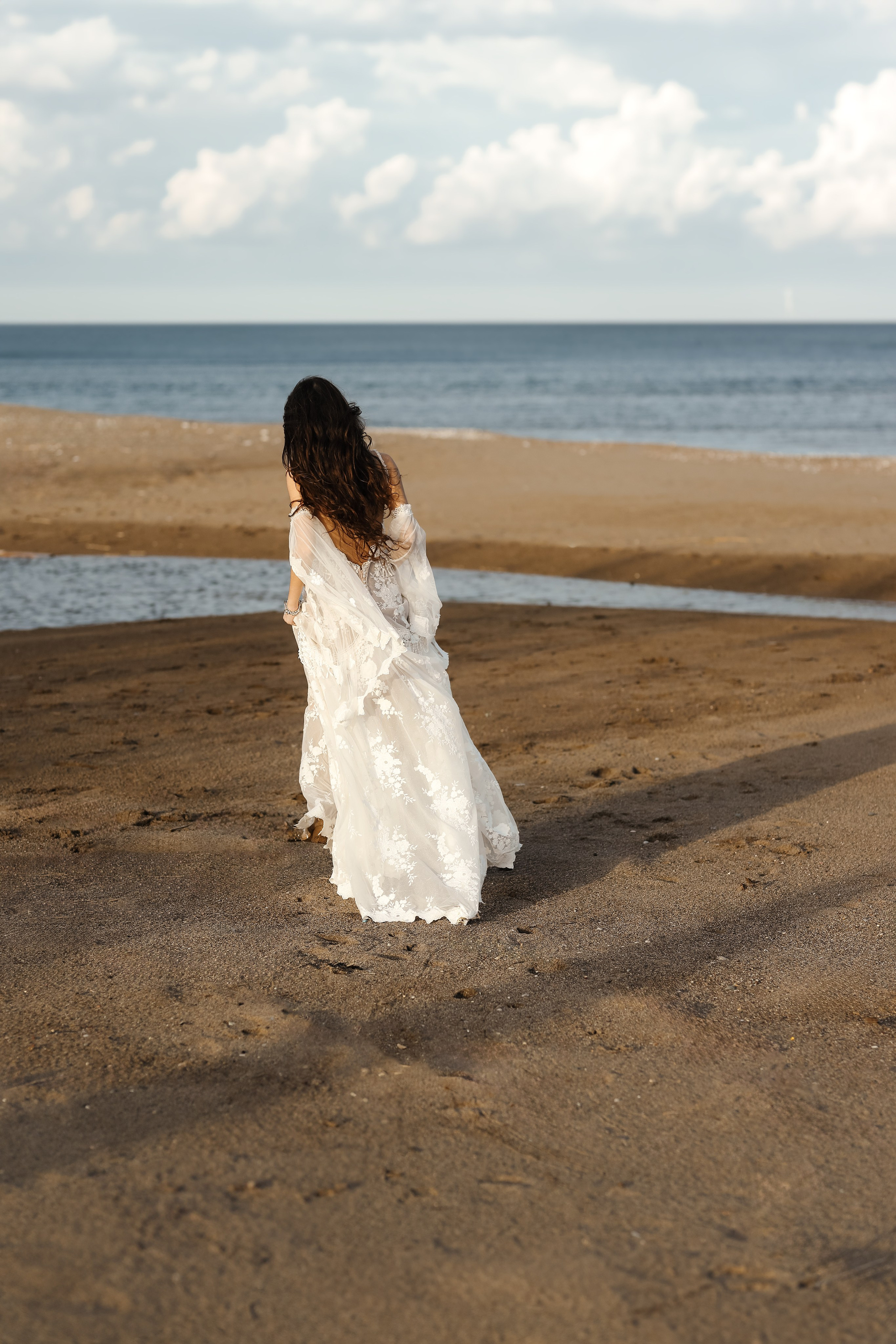 A portrait of girl in a wedding dress next to the sea. Rhodes, Greece