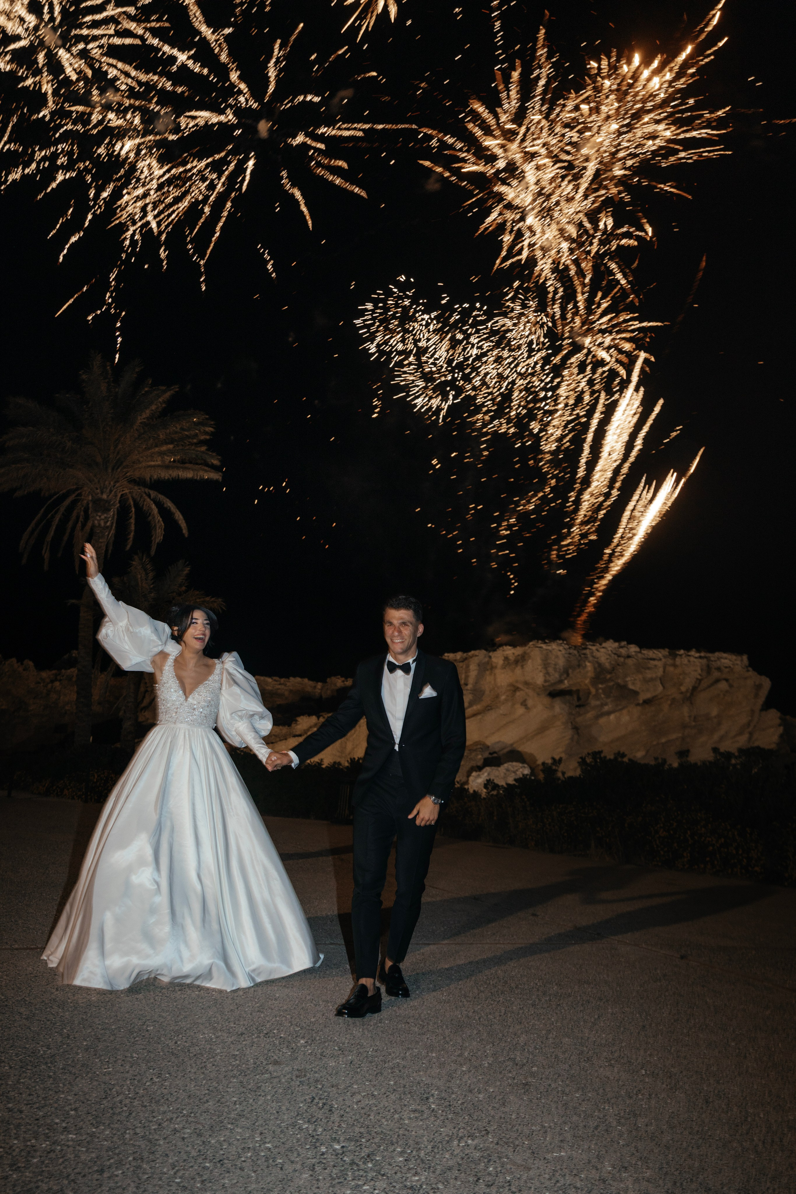 Bride and groom are watching the firework. Rhodes Greece