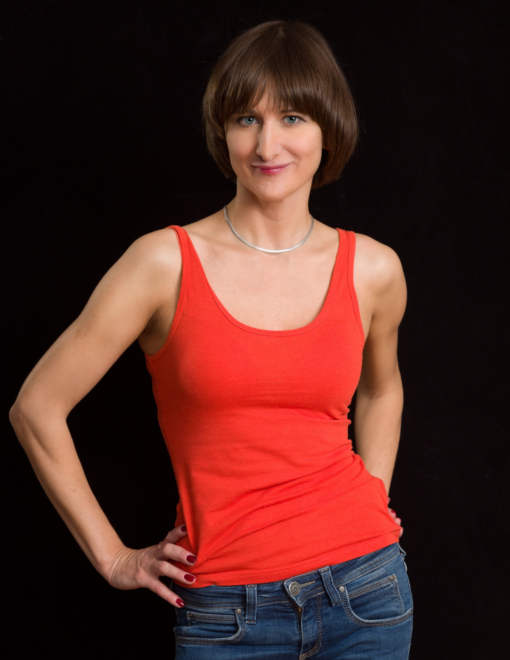 Portrait of a young lady on dark studio background - photographer Andrey Dunin
