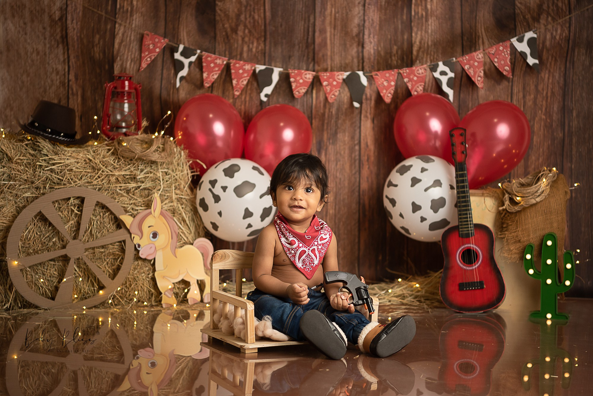 cowboy themed setup for one year old boy for his pre birthday photoshoot in Doha.