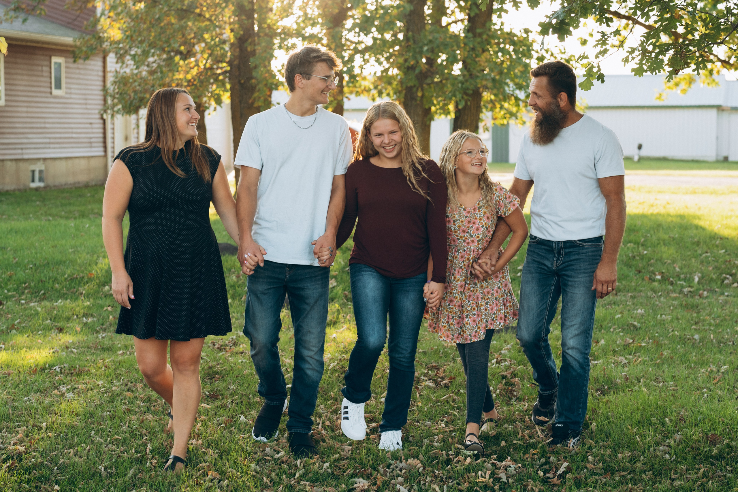 Family walking hand in hand outdoors
