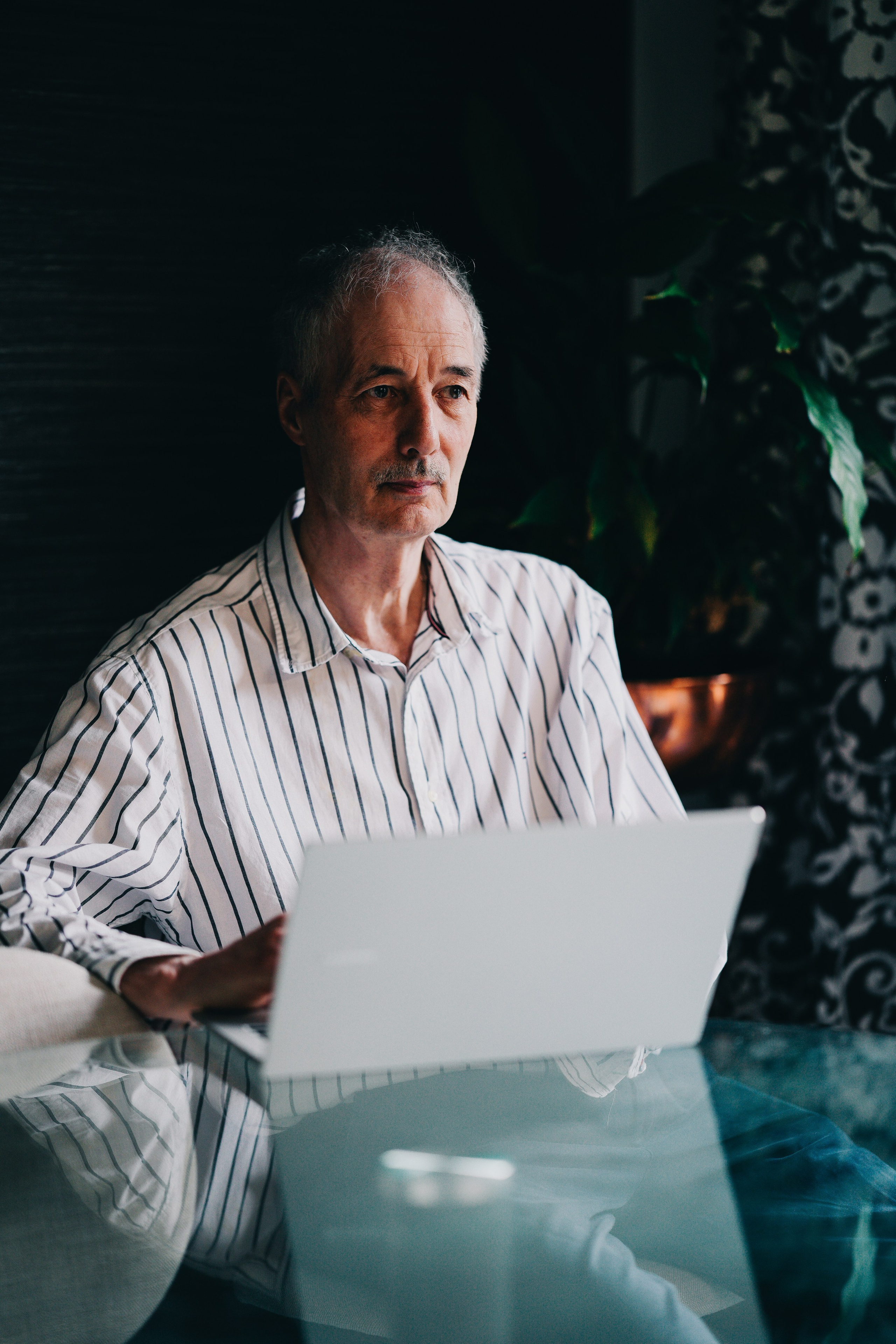 Lifestyle brand portrait of a professional working on a laptop, photographed in natural light in Birmingham.