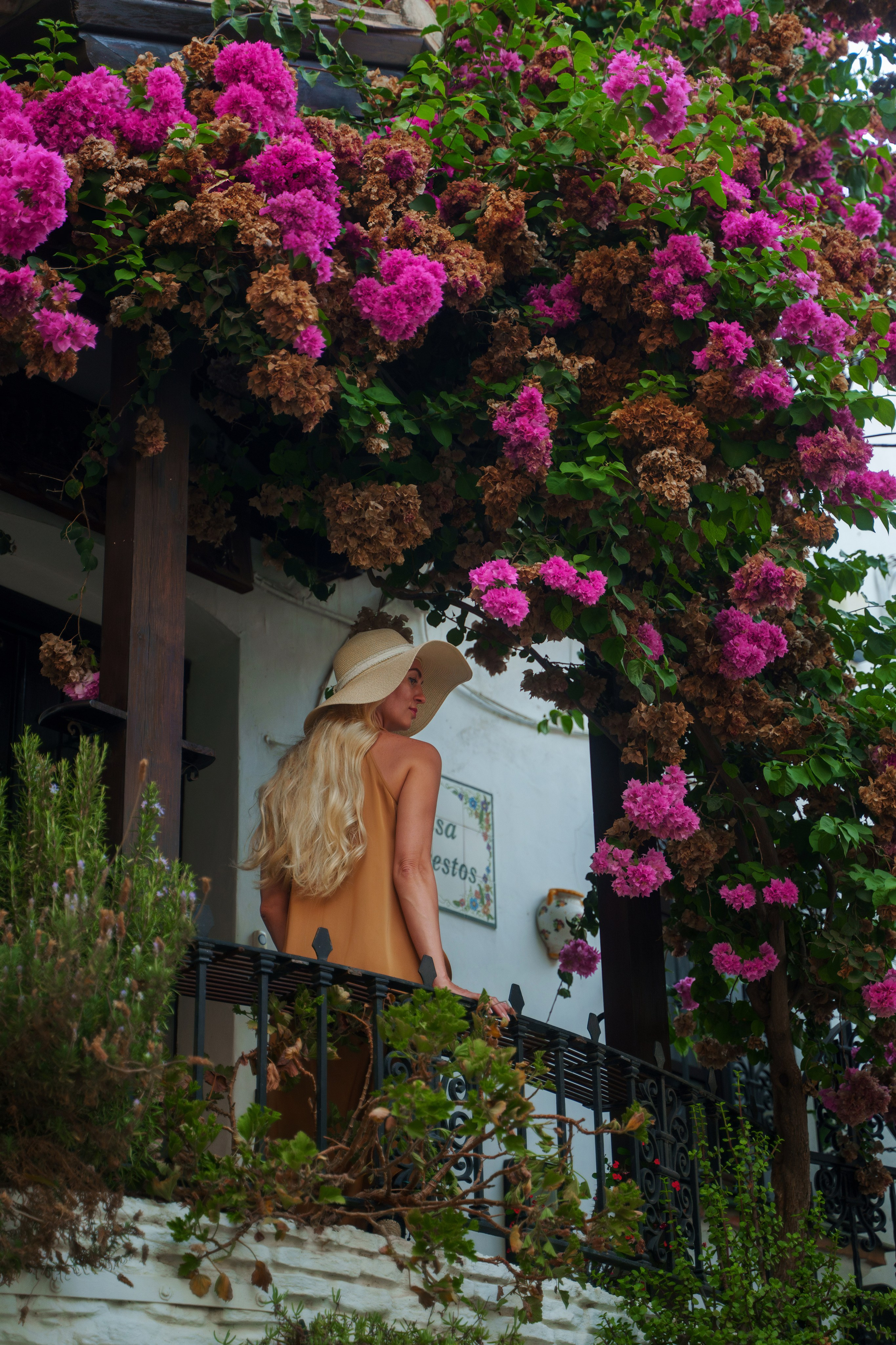 Estepona old town street photography of an elegant blonde model by Costa del Sol female photographer
