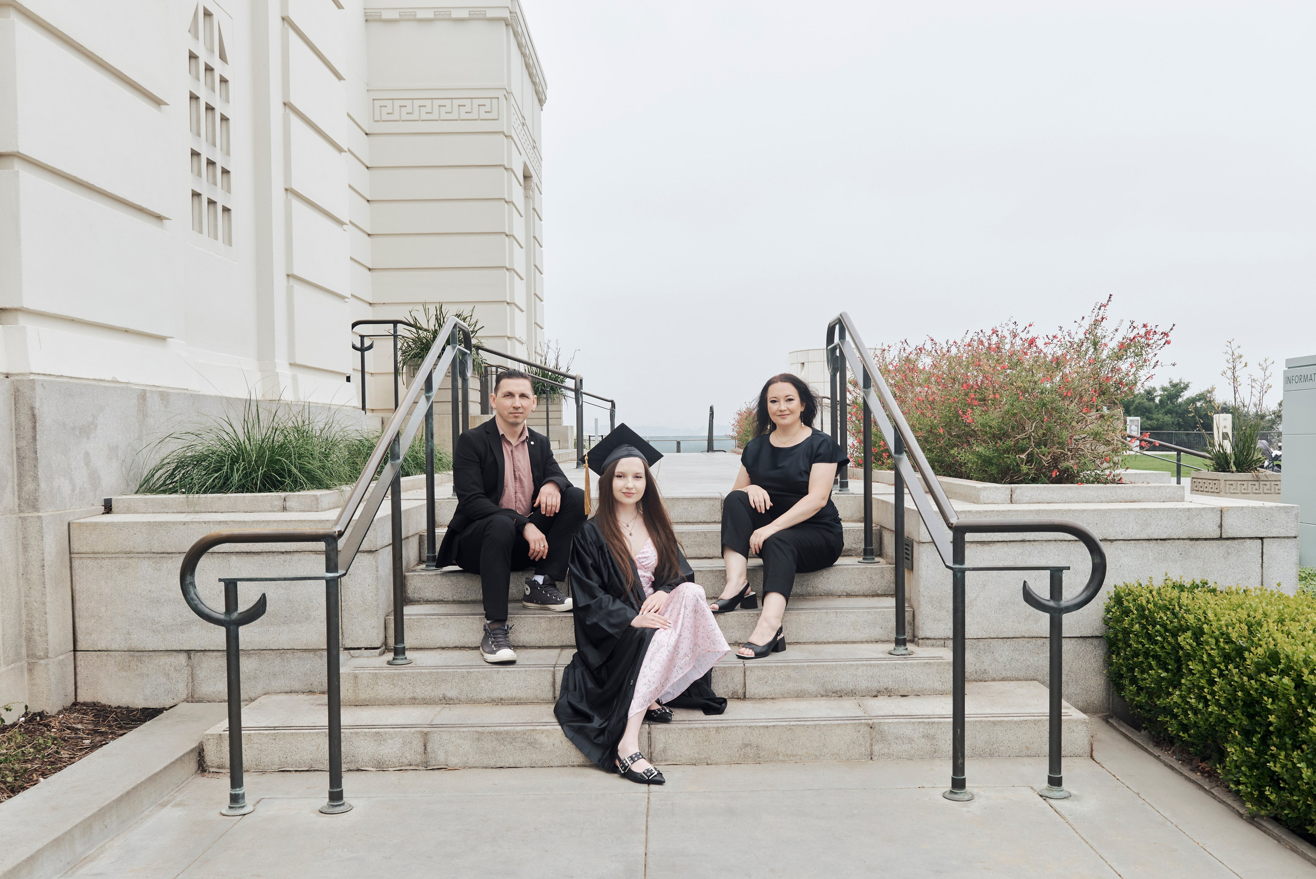 Elegant graduation portrait of a student in cap and gown at a classic Los Angeles venue