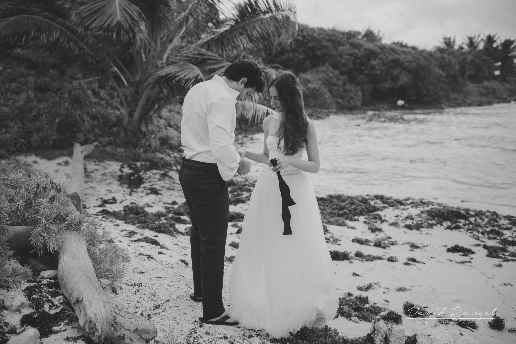 Secilia and Brandon tras the dress at the Conrad Tulum Hotel. Destination wedding photographer based in Cancun and Riviera Maya with service worldwide