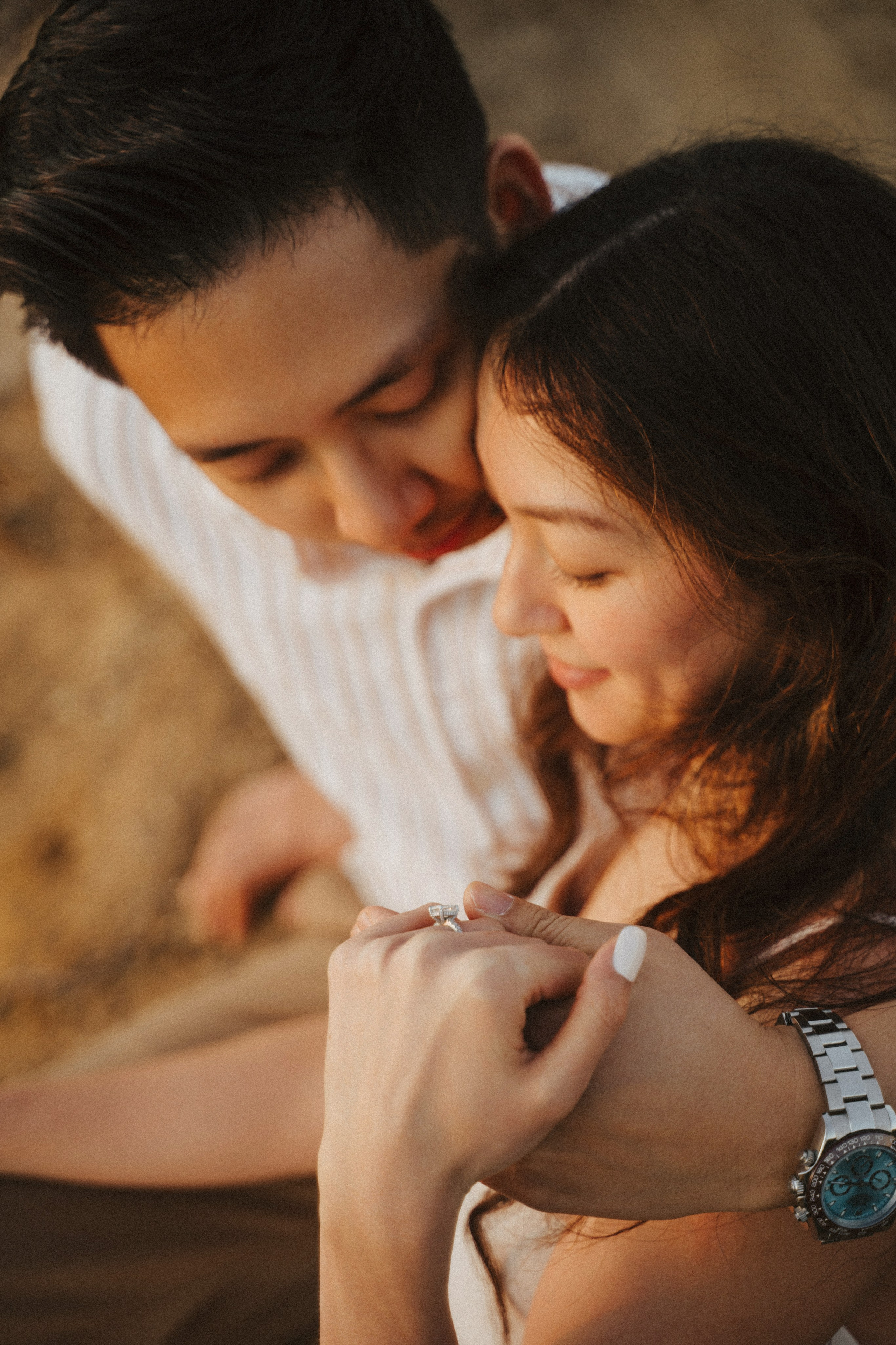 A photo shoot on the San Francisco beach at sunset. Engagement session. 