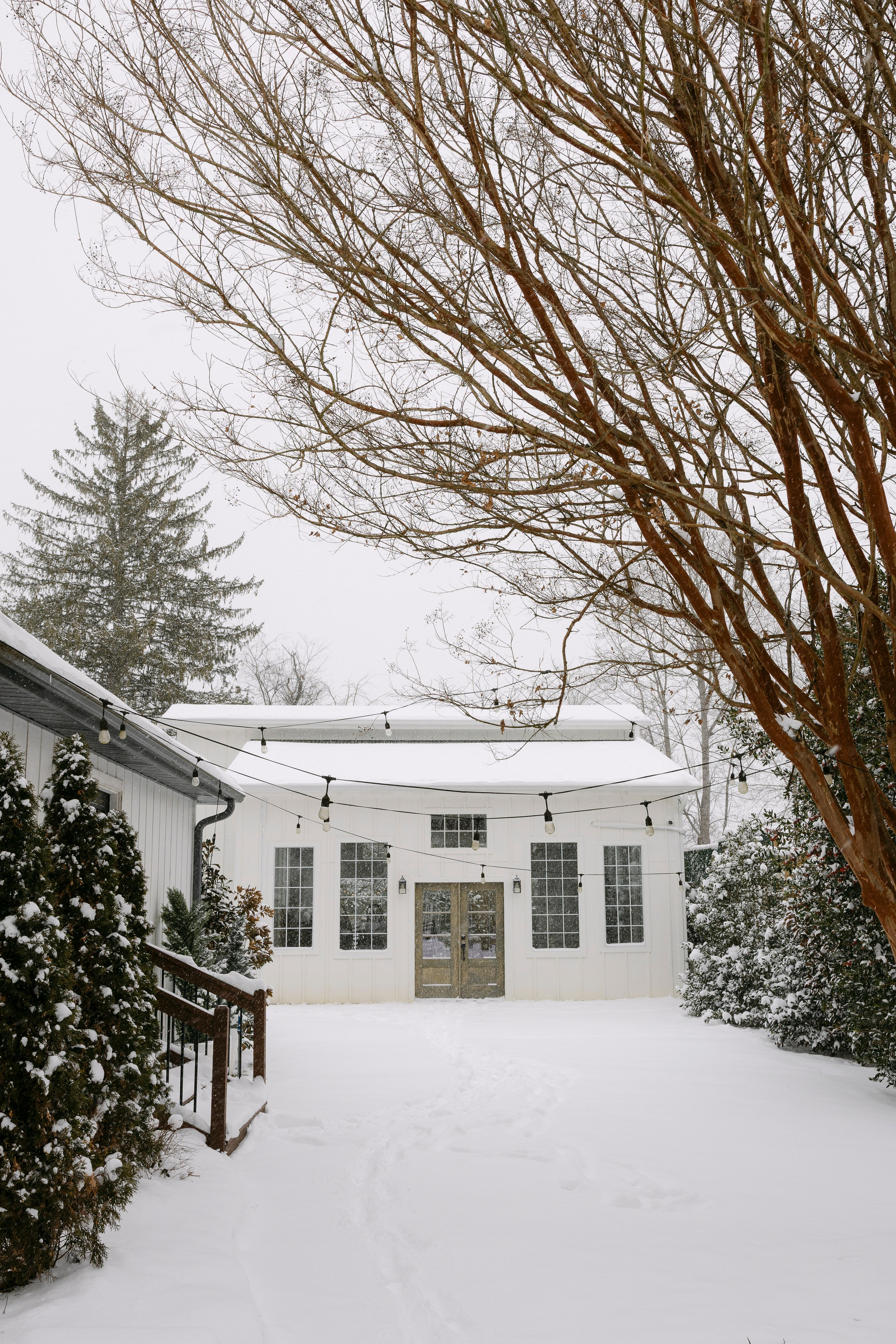 Winter Snow Wedding at Luxe Glass House at River Mill | A Rare & Romantic North Carolina Celebration. Wedding and portrait photography in Greenville SC