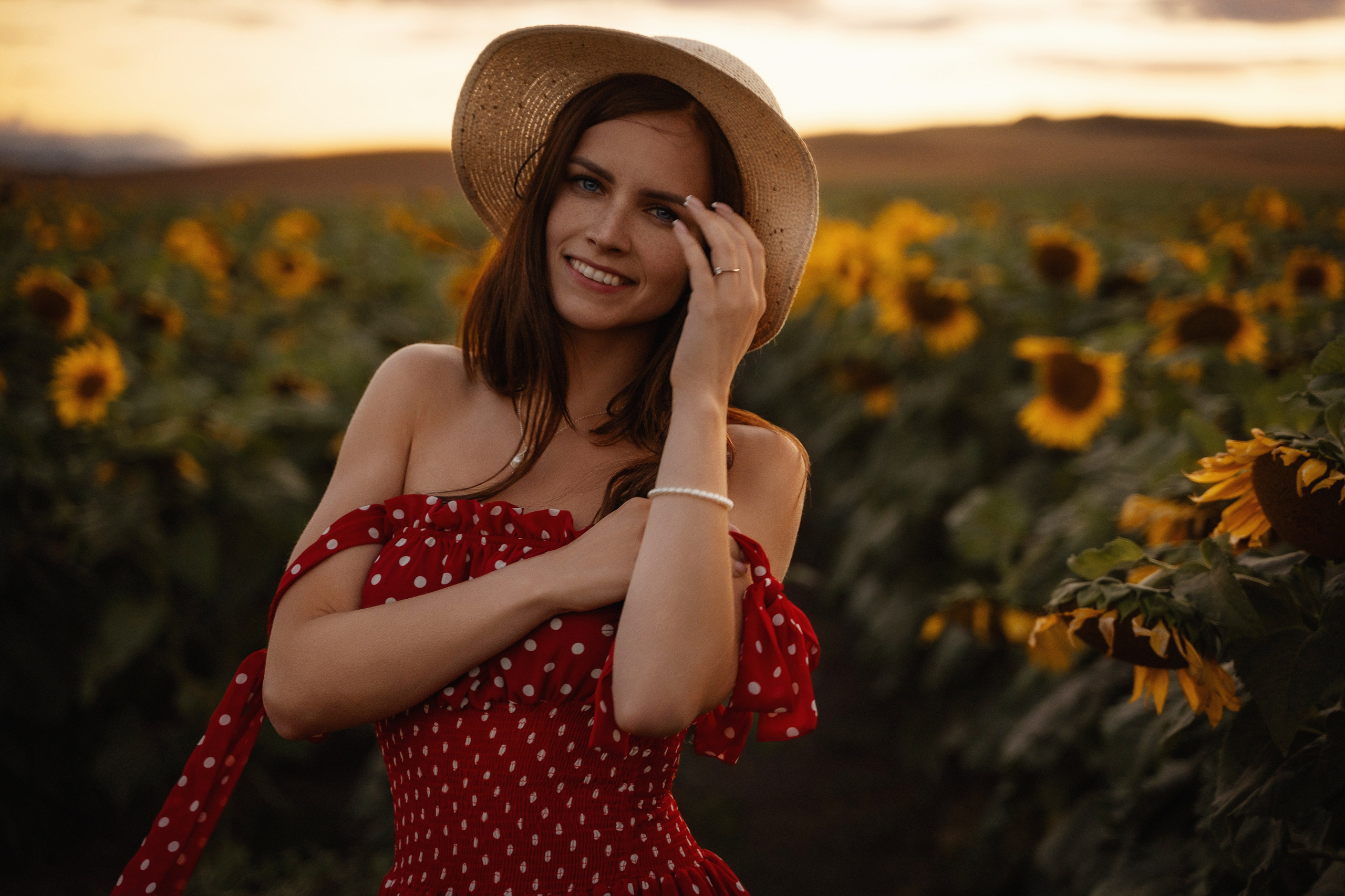 Young beautiful model in sunflower field at sunset, captured by portrait photographer in Marbella"