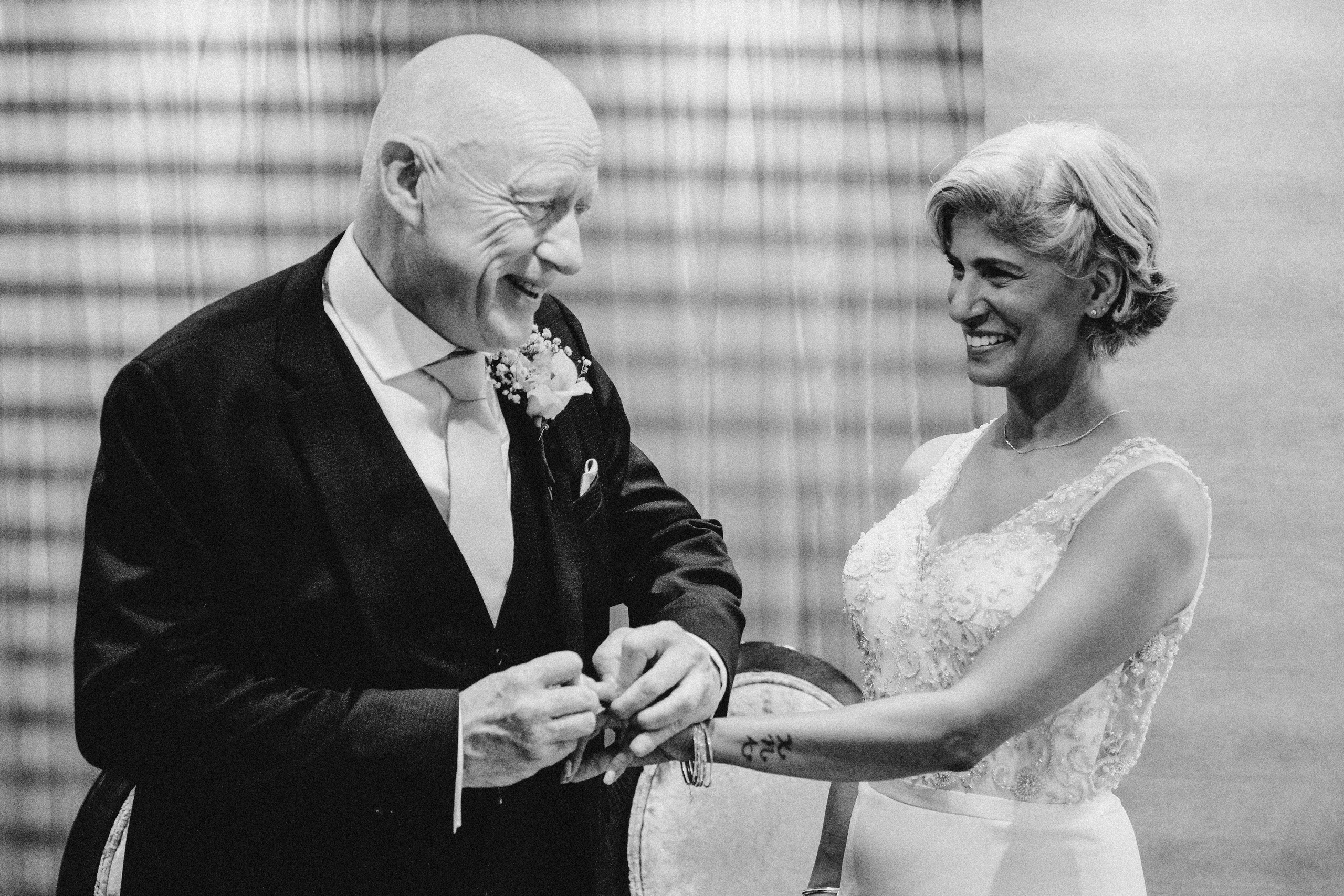 Bride smiling at groom during registry office ceremony in Solihull