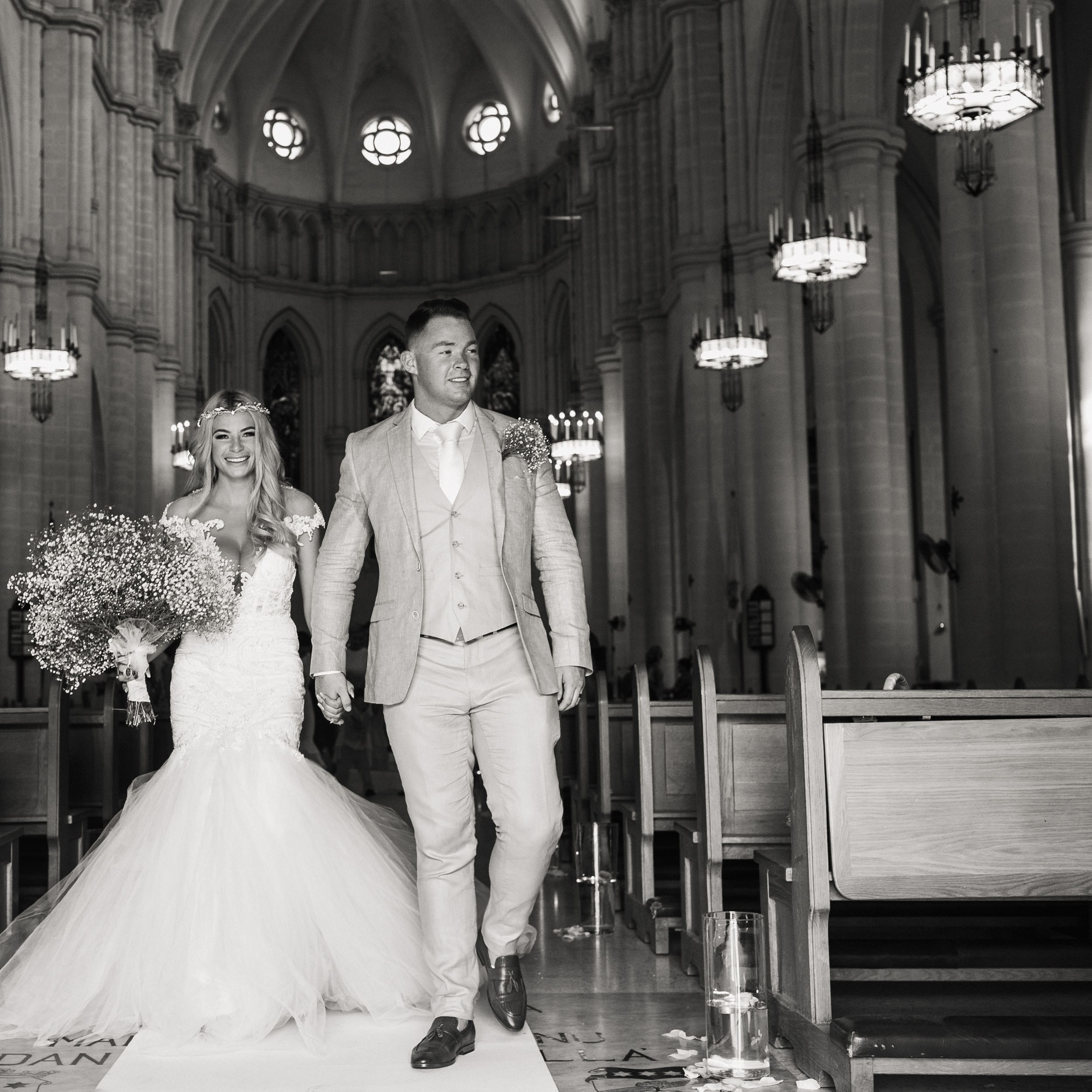 Bride and groom are exiting the cathedral