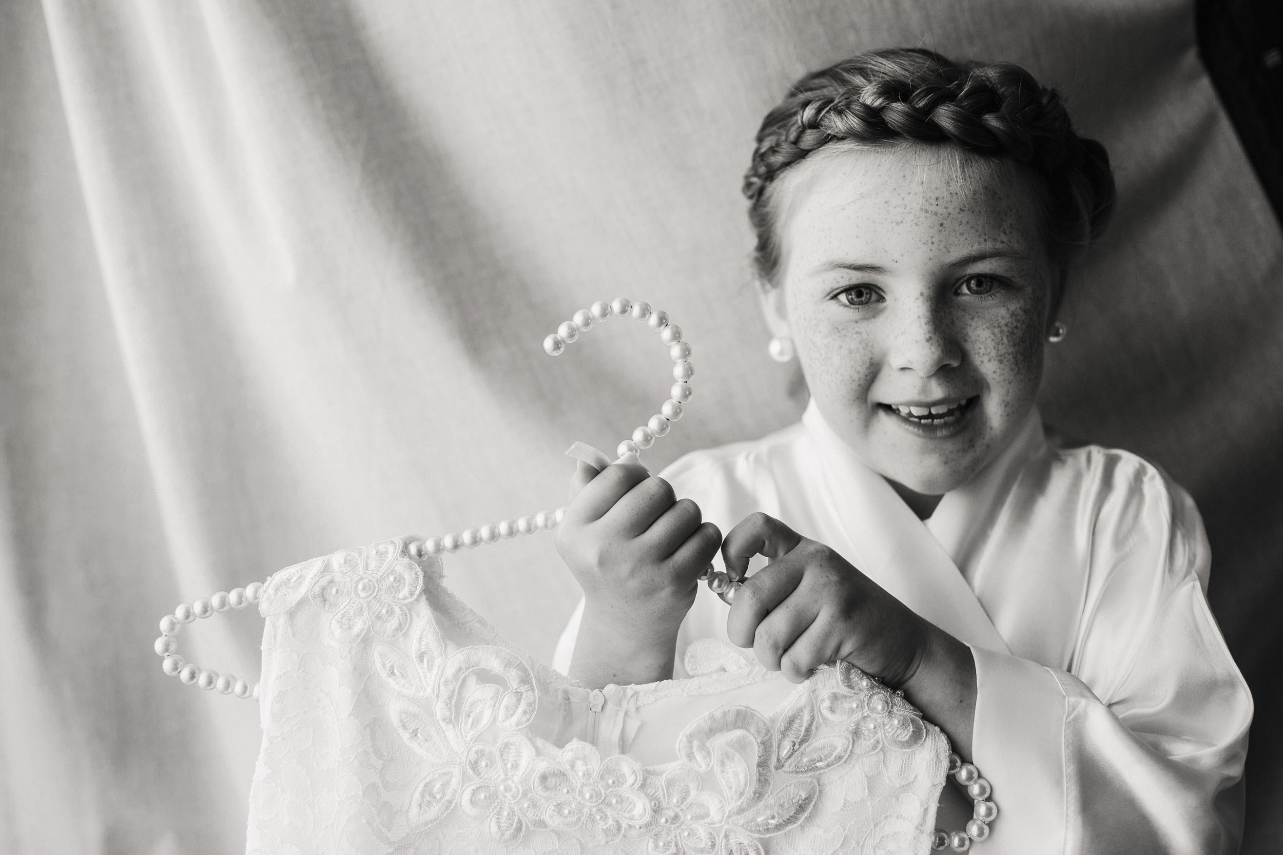 Girl is holding her beautiful white dress