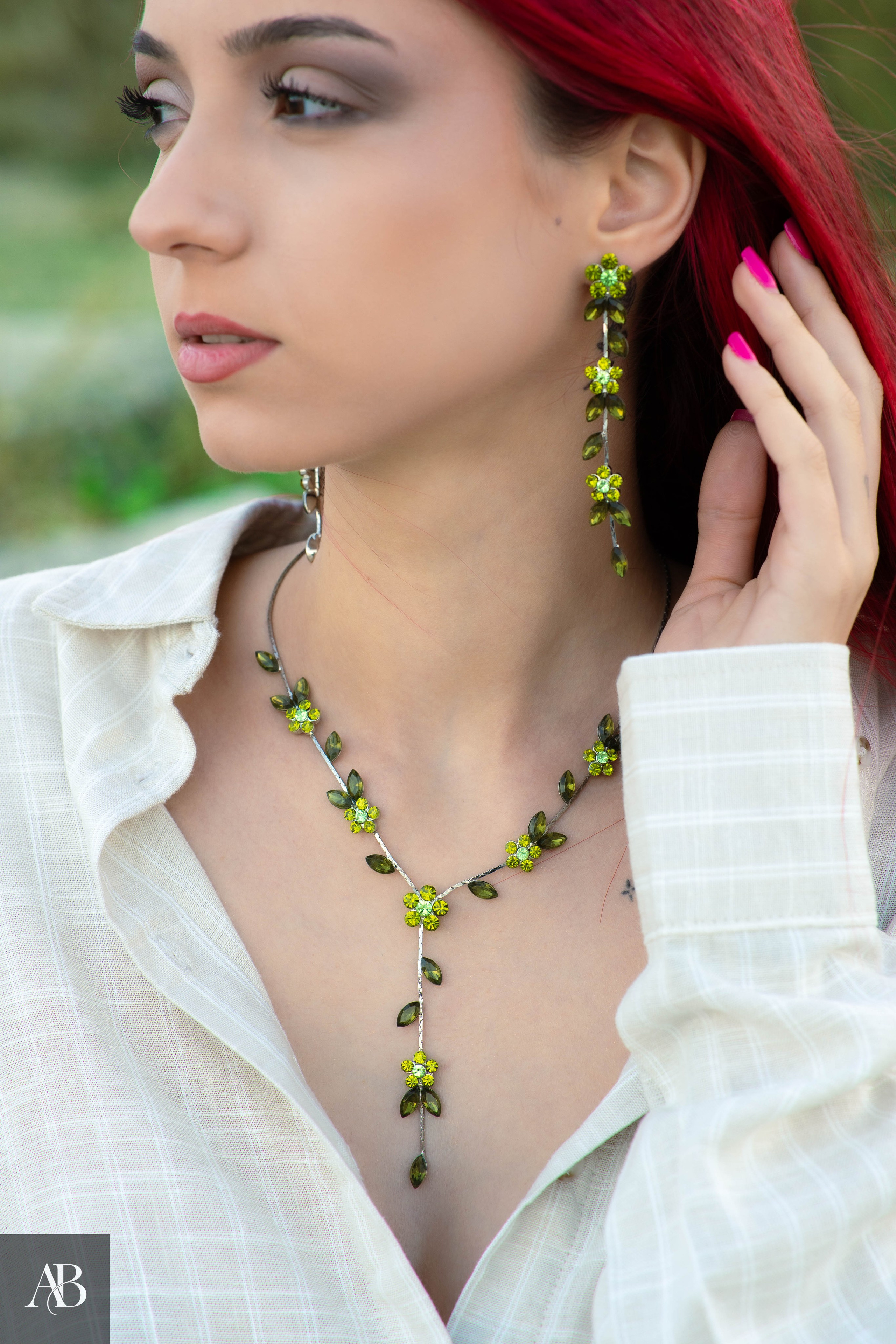 Jewelry product photography in Constanța, Romania featuring a green gemstone necklace and matching earrings.