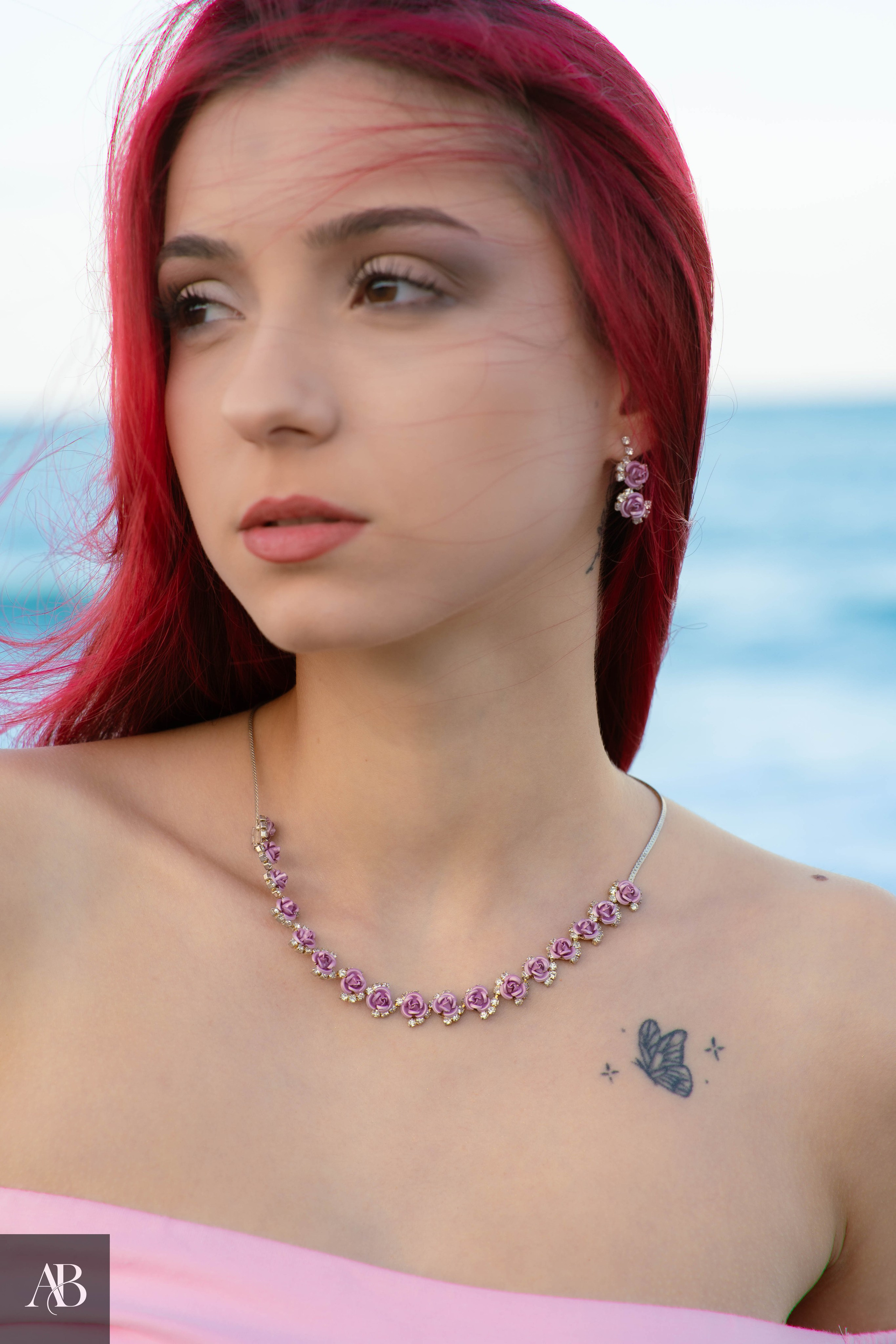 Jewelry product photography in Constanța, Romania featuring a pink gemstone necklace and matching earrings.