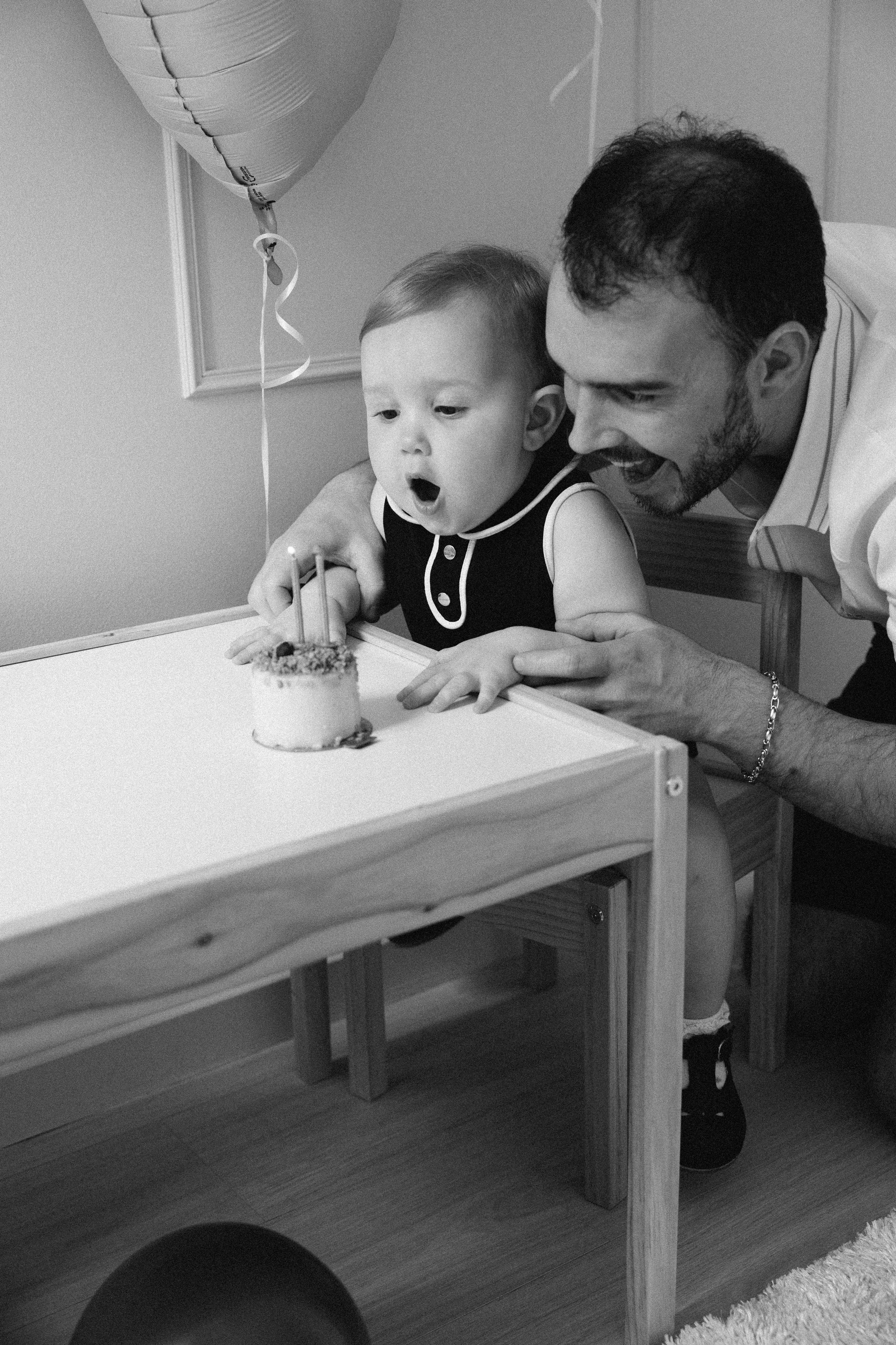 Father with daughter at the table, black and white photo