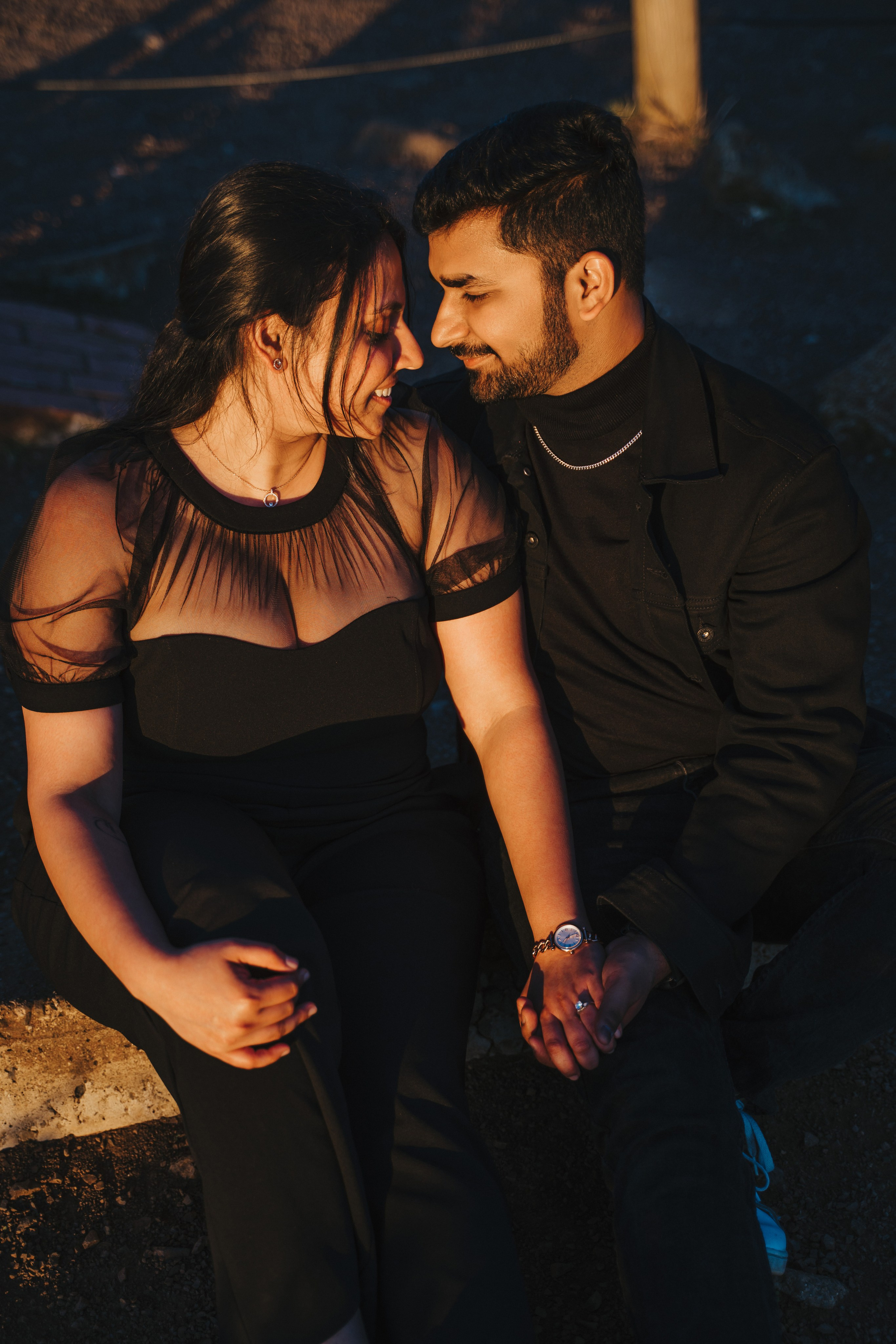Proposal.  Overlooking the golden San Franisco Bridge sunset with a couple. Photographer Video. 
