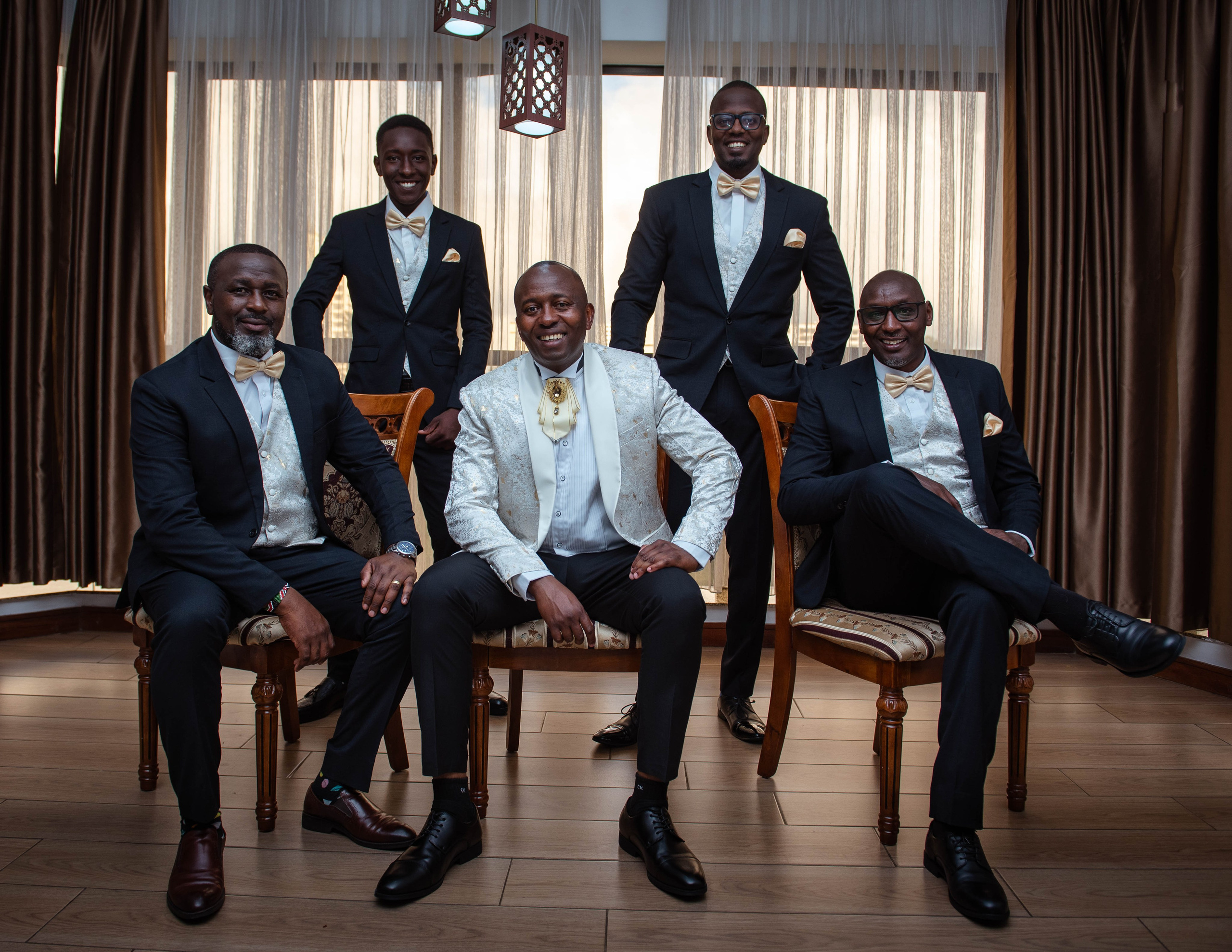 A classic wedding portrait of the groom and his four groomsmen at a hotel in Nairobi.