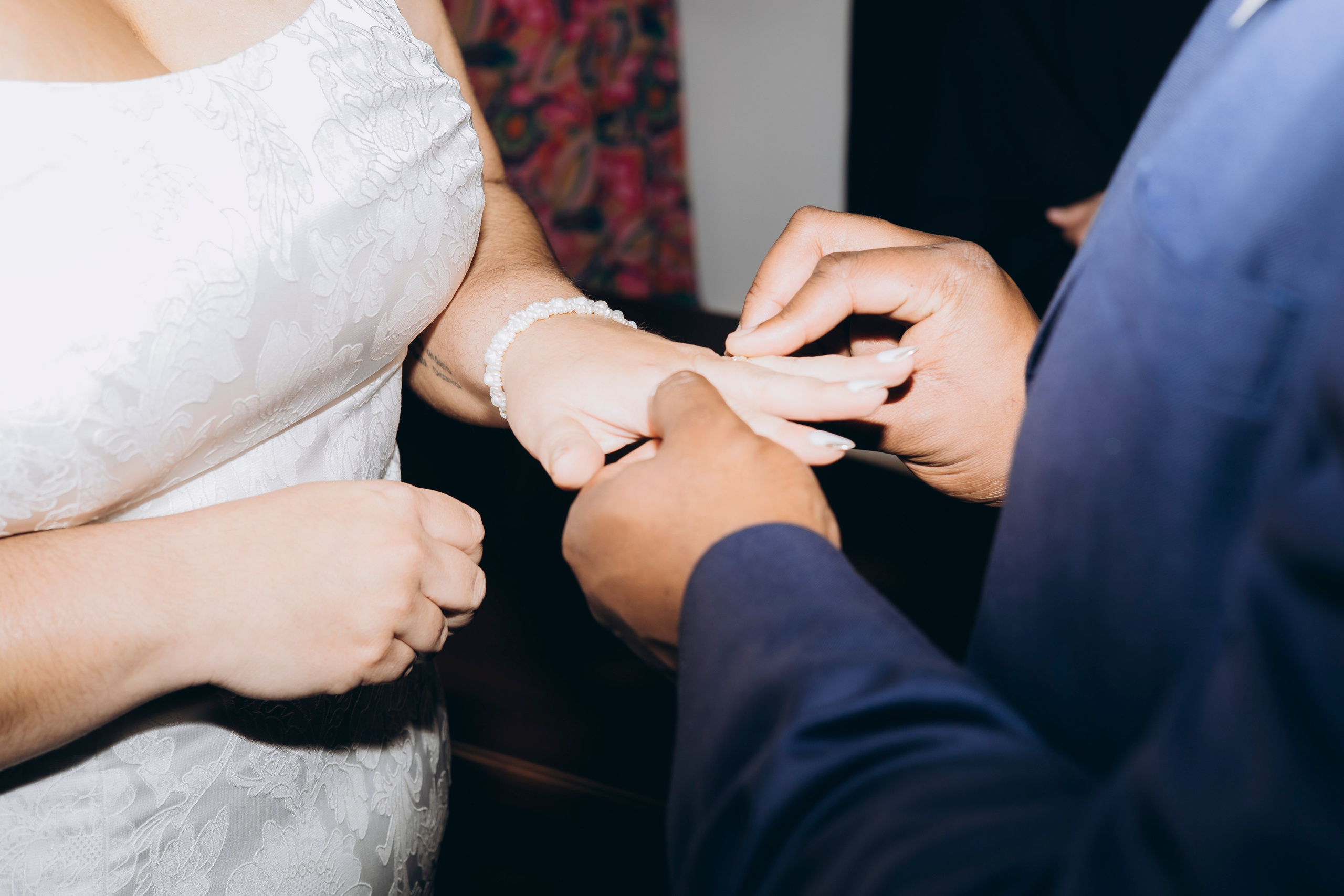 Close-up of engagement rings on couple's hands at Chicago City Hall elopement