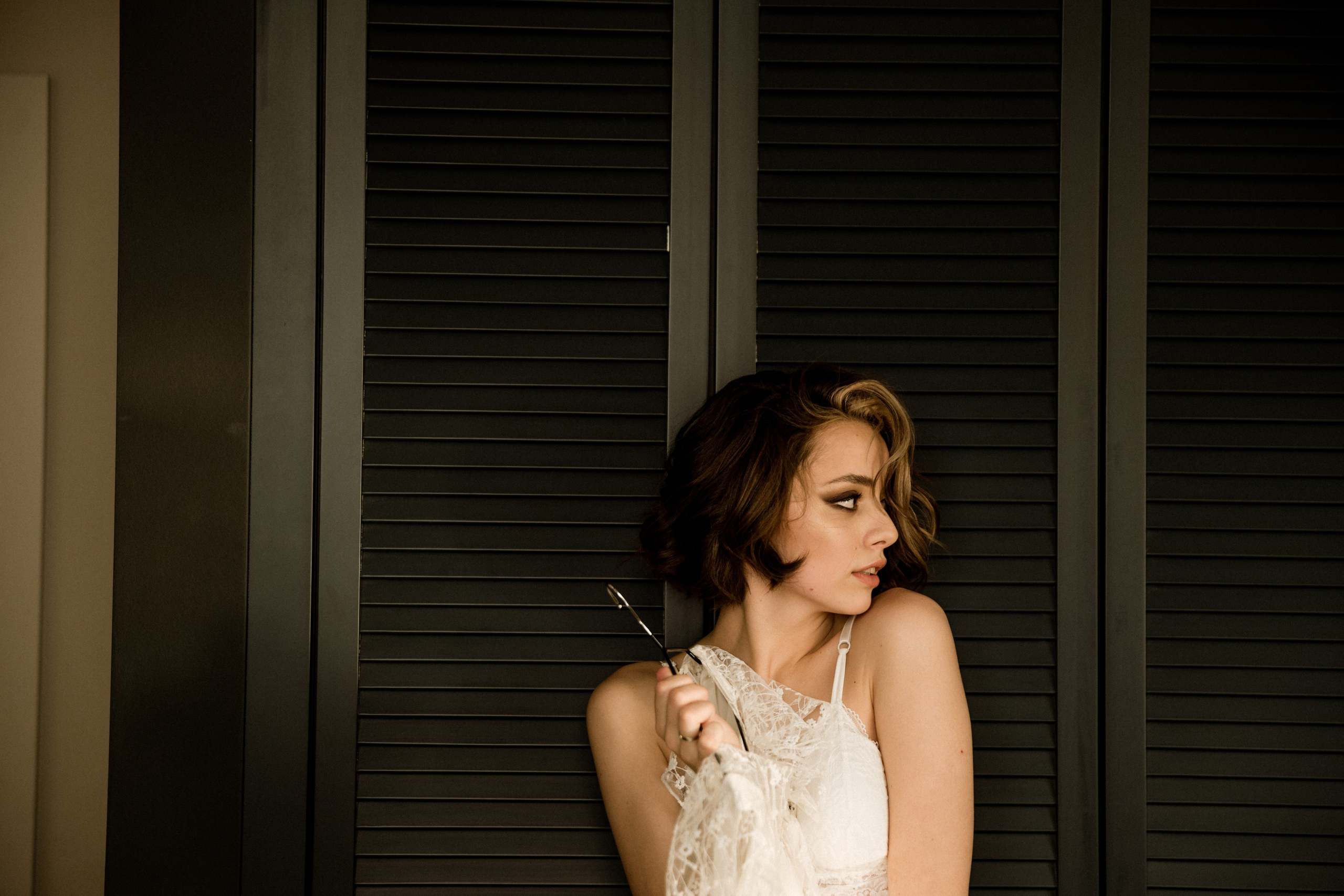 Bride getting ready boudoir style before seaside ceremony, wedding photography France