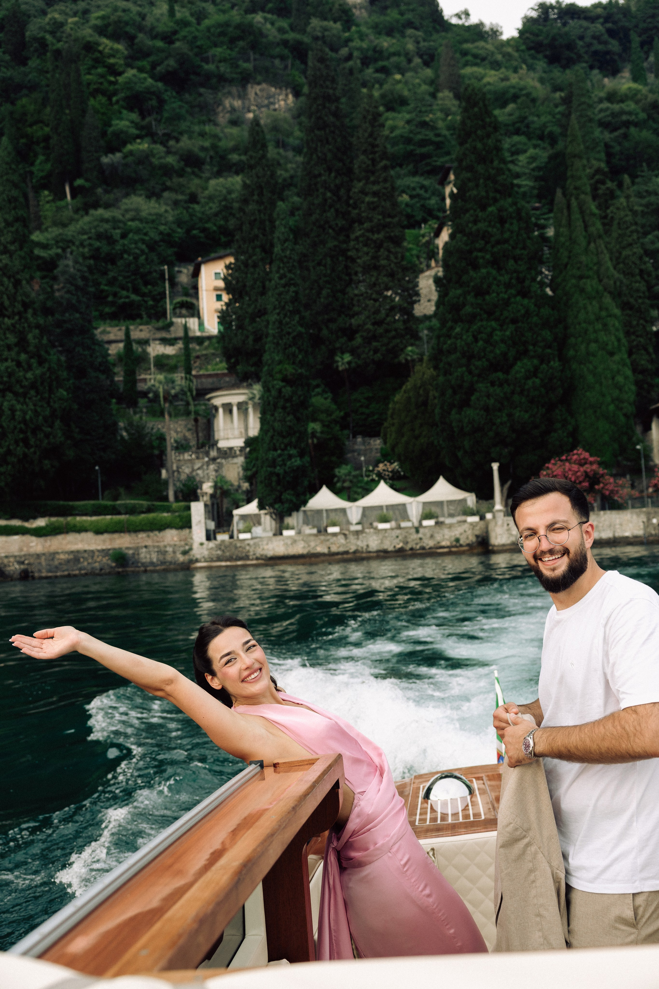 Newly engaged couple celebrating their proposal with beautiful Lake Como views