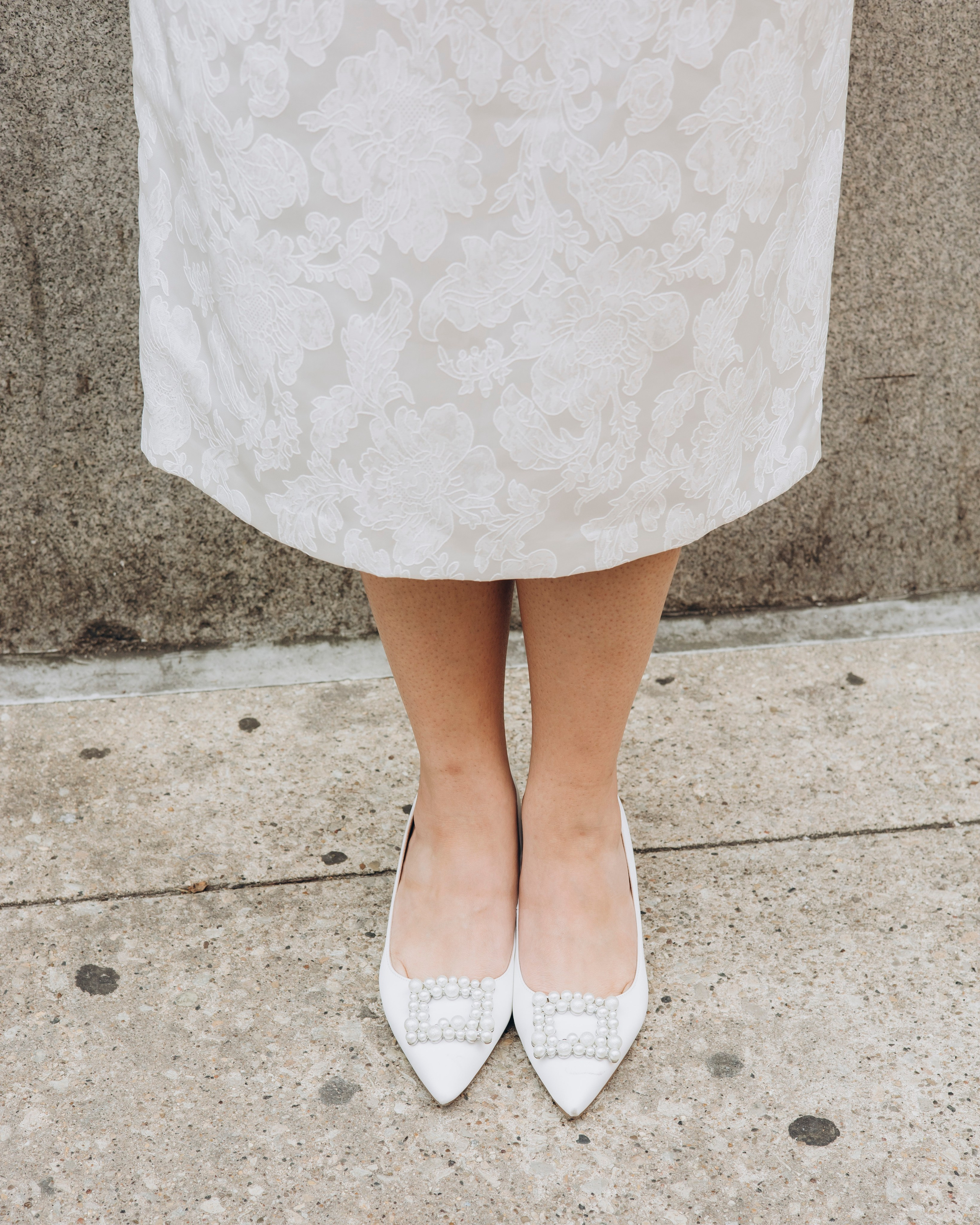 Close-up of bride’s shoes and wedding dress details in Chicago