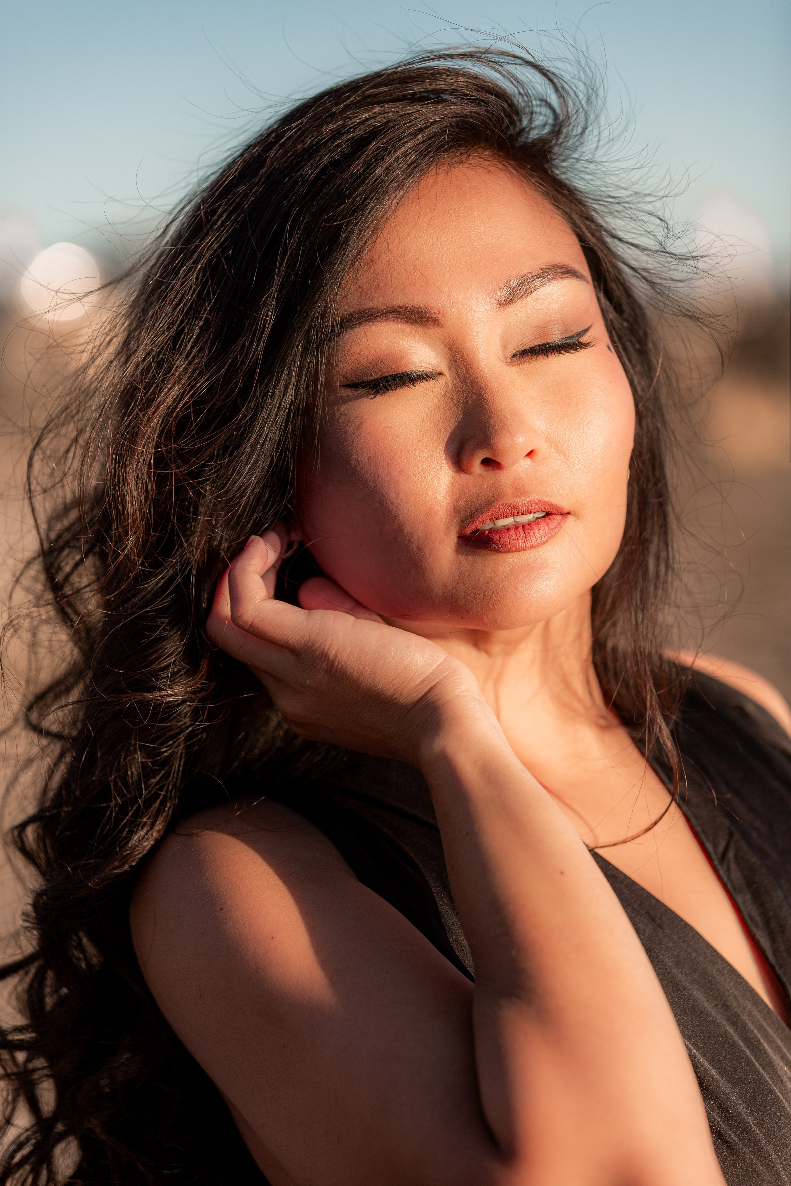 Individual photoshoot by the water in Windsor, blending creative angles and natural surroundings for a breathtaking portrait.”