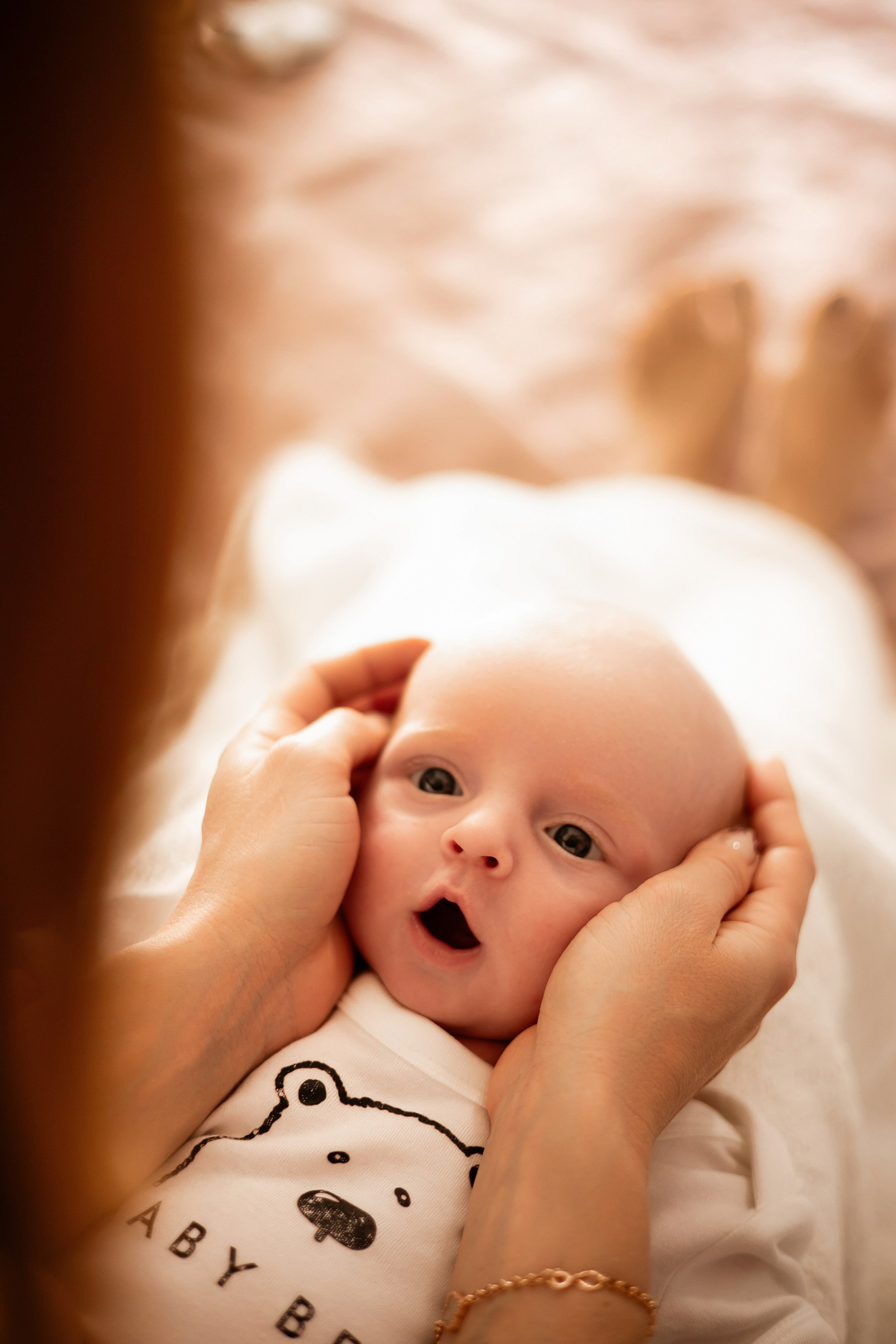 Baby lying on a soft blanket in the nursery