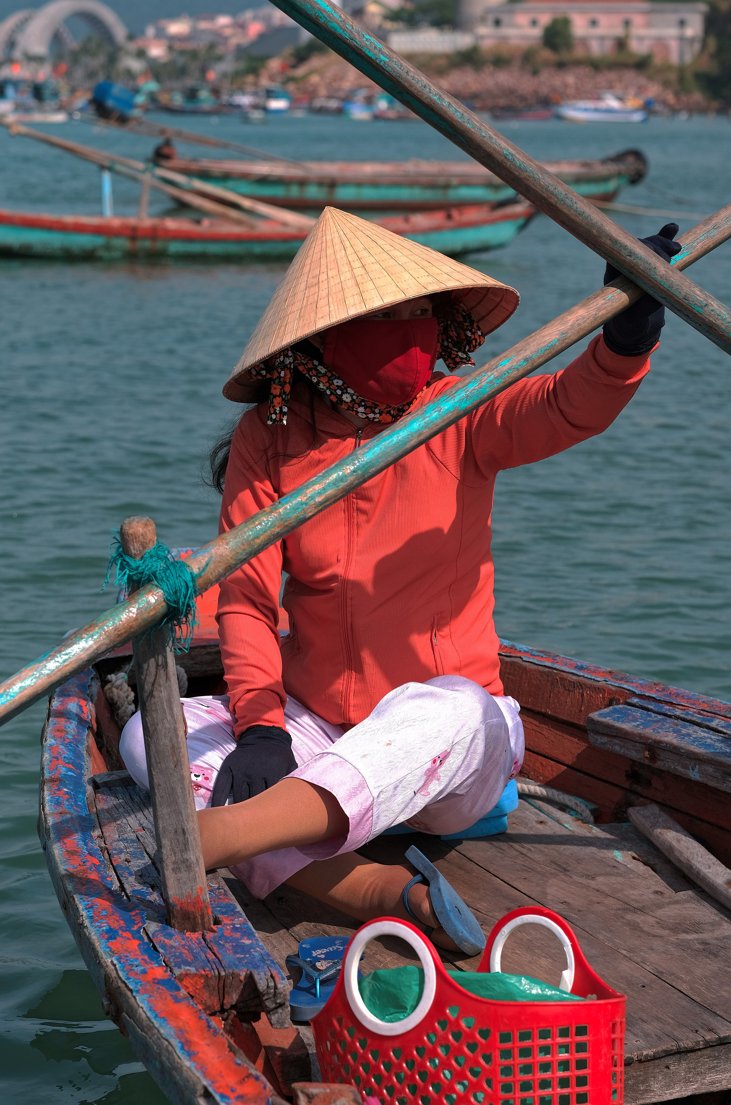 Vietnamese Fisherwoman in Traditional Conical Hat on Boat