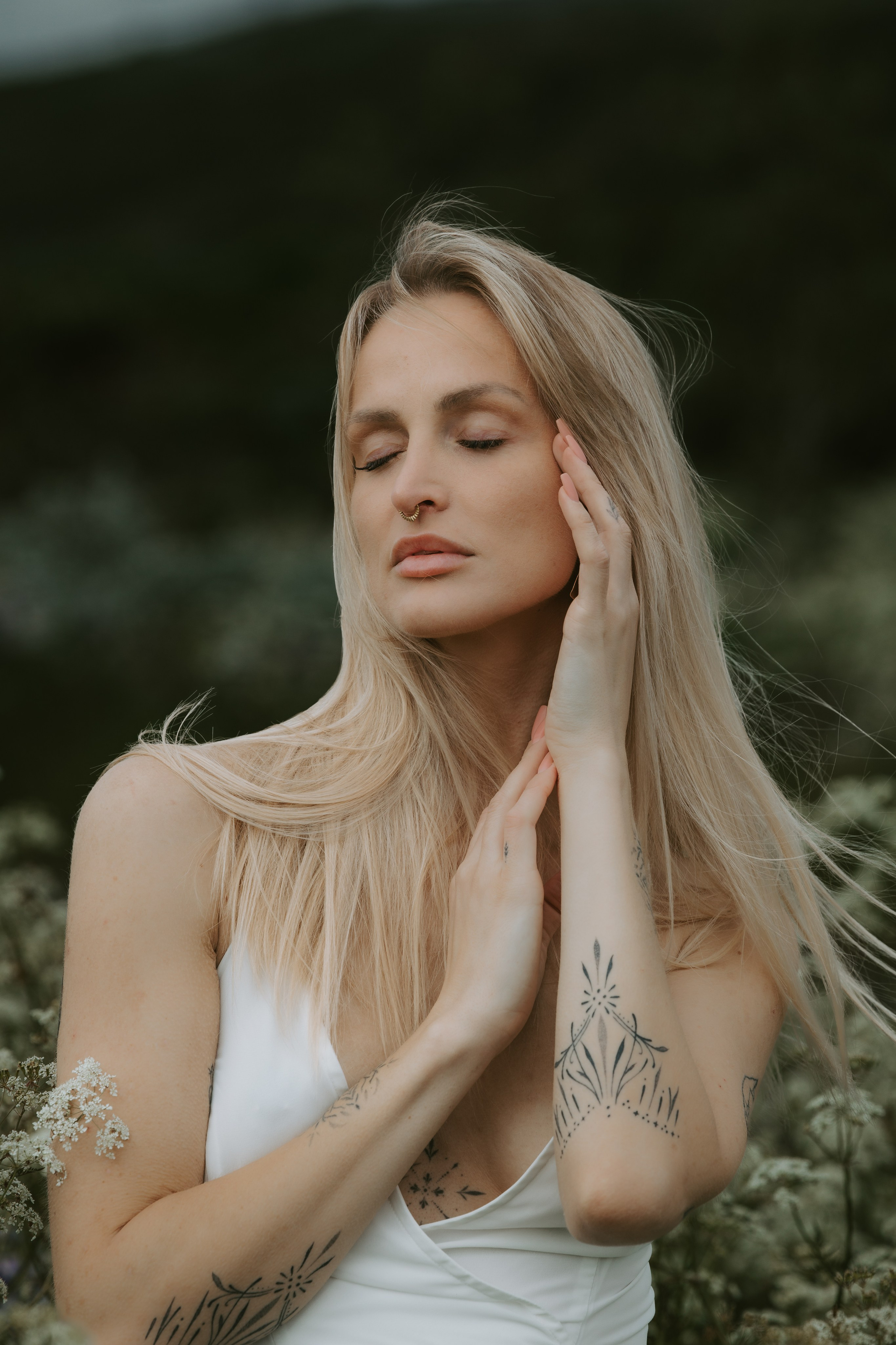 Wind in her hair—dreamy feminine portrait in Iceland’s dramatic natural scenery.