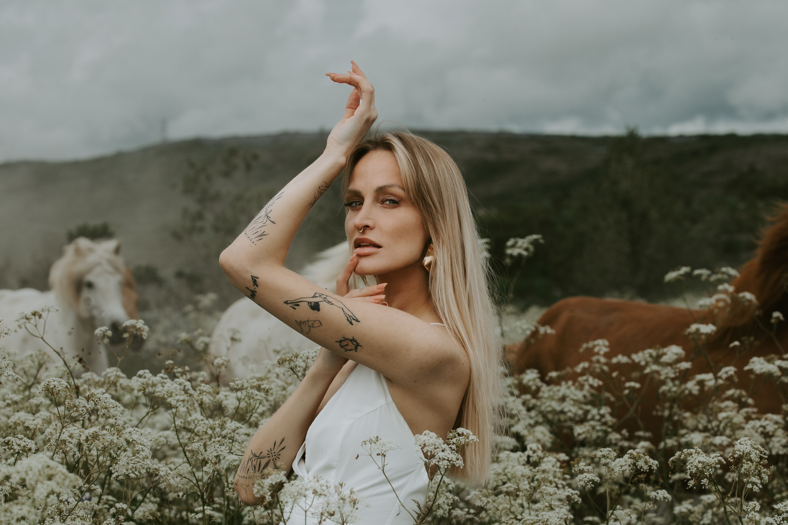 Wind in her hair—dreamy feminine portrait in Iceland’s dramatic natural scenery.