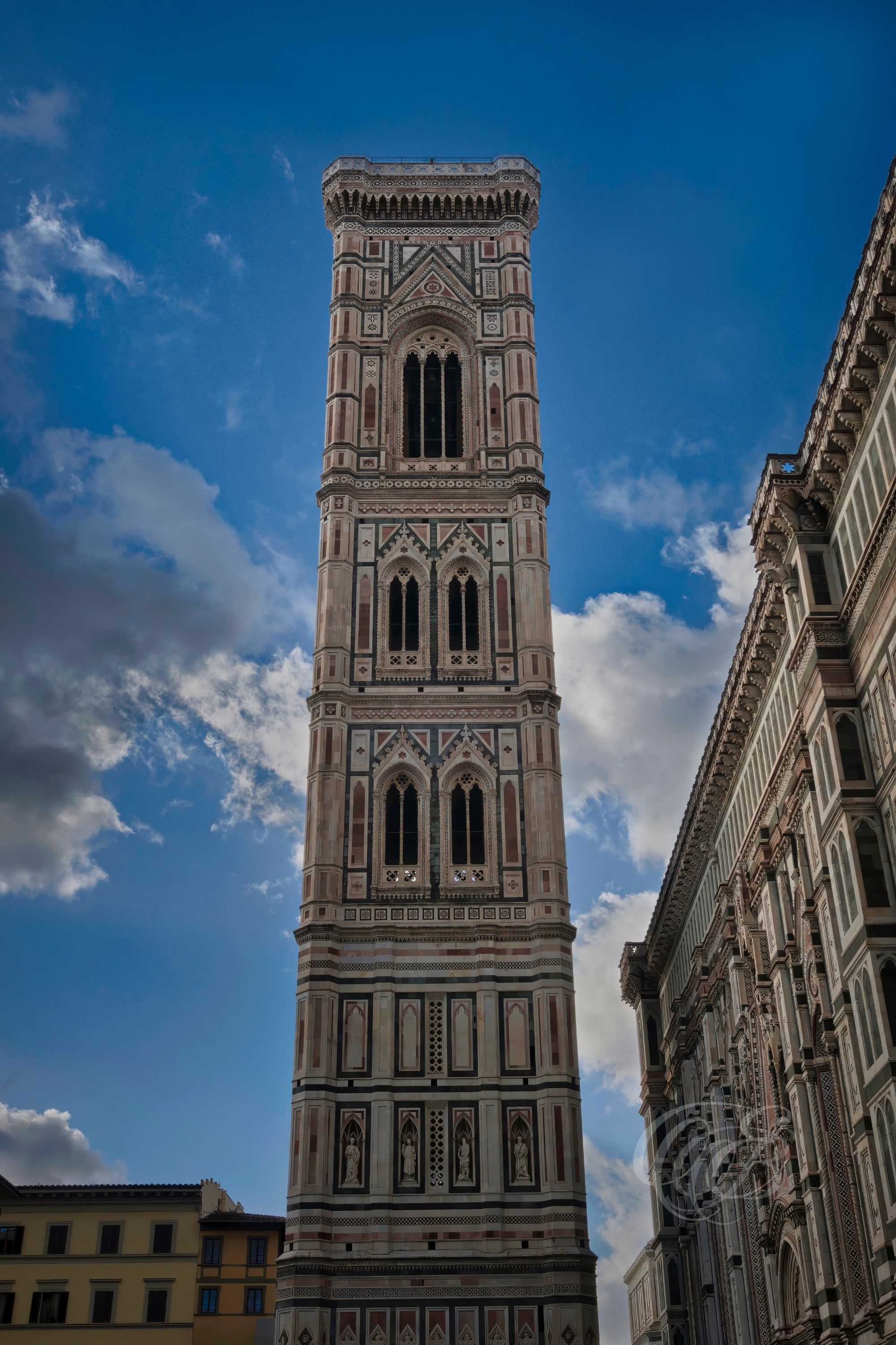 Florence, Italy—Giotto’s Bell Tower, part of the Santa Maria del Fiore cathedral complex, was begun in 1334 under Giotto di Bondone and completed by later architects. It stands as one of the most important examples of Florentine Gothic architecture and reflects the artistic and civic development of medieval Florence. Eduardo Bartoli Photography.