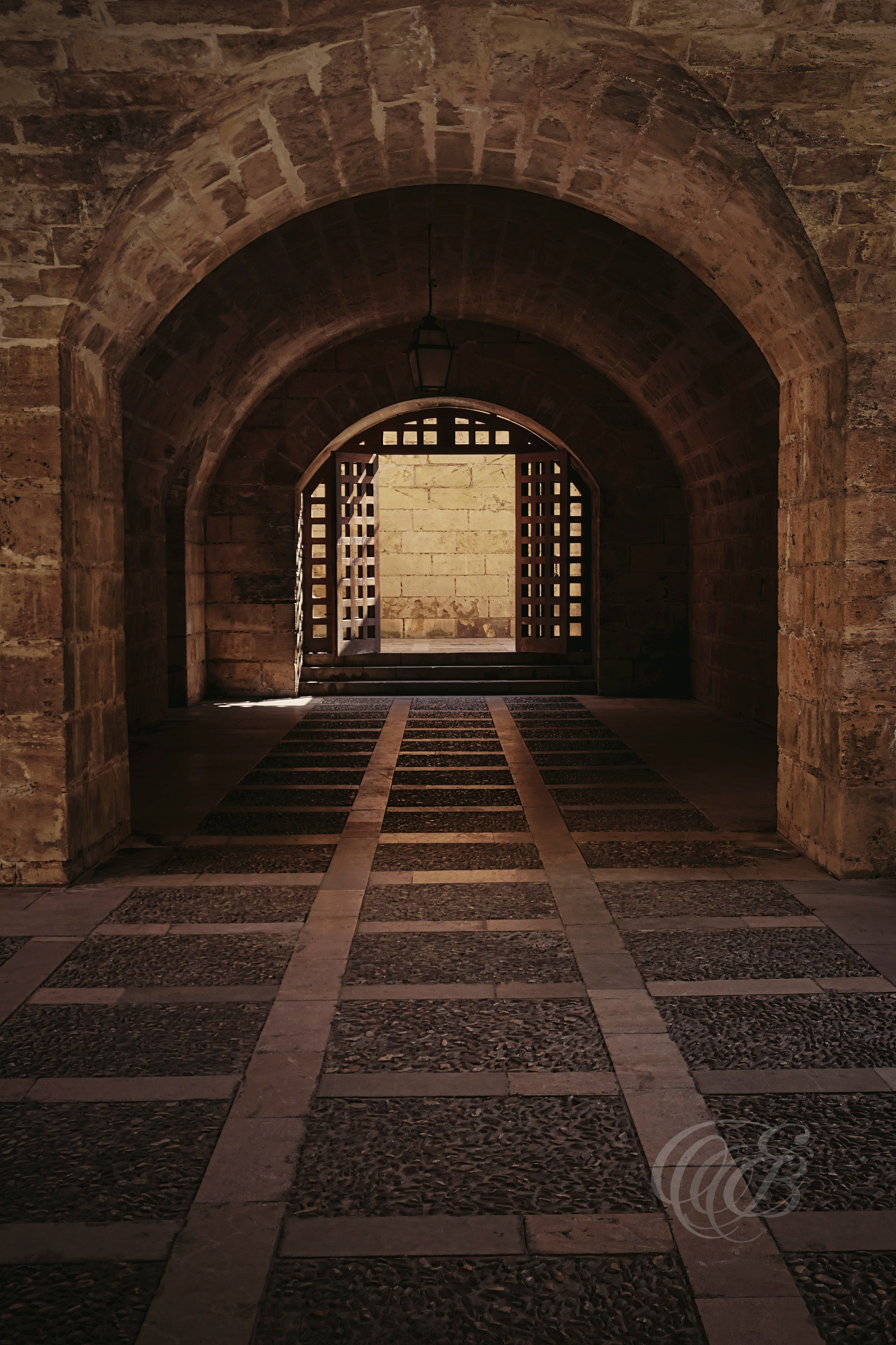 The Royal Palace of La Almudaina stands as one of Palma de Mallorca’s most significant historic landmarks, reflecting centuries of architectural and cultural influences that have shaped the island. Its interior spaces preserve elements of Mallorca’s medieval past while continuing to serve ceremonial functions in the present day. This photograph explores part of the palace’s architectural character, highlighting the enduring craftsmanship and atmosphere found within the historic complex.