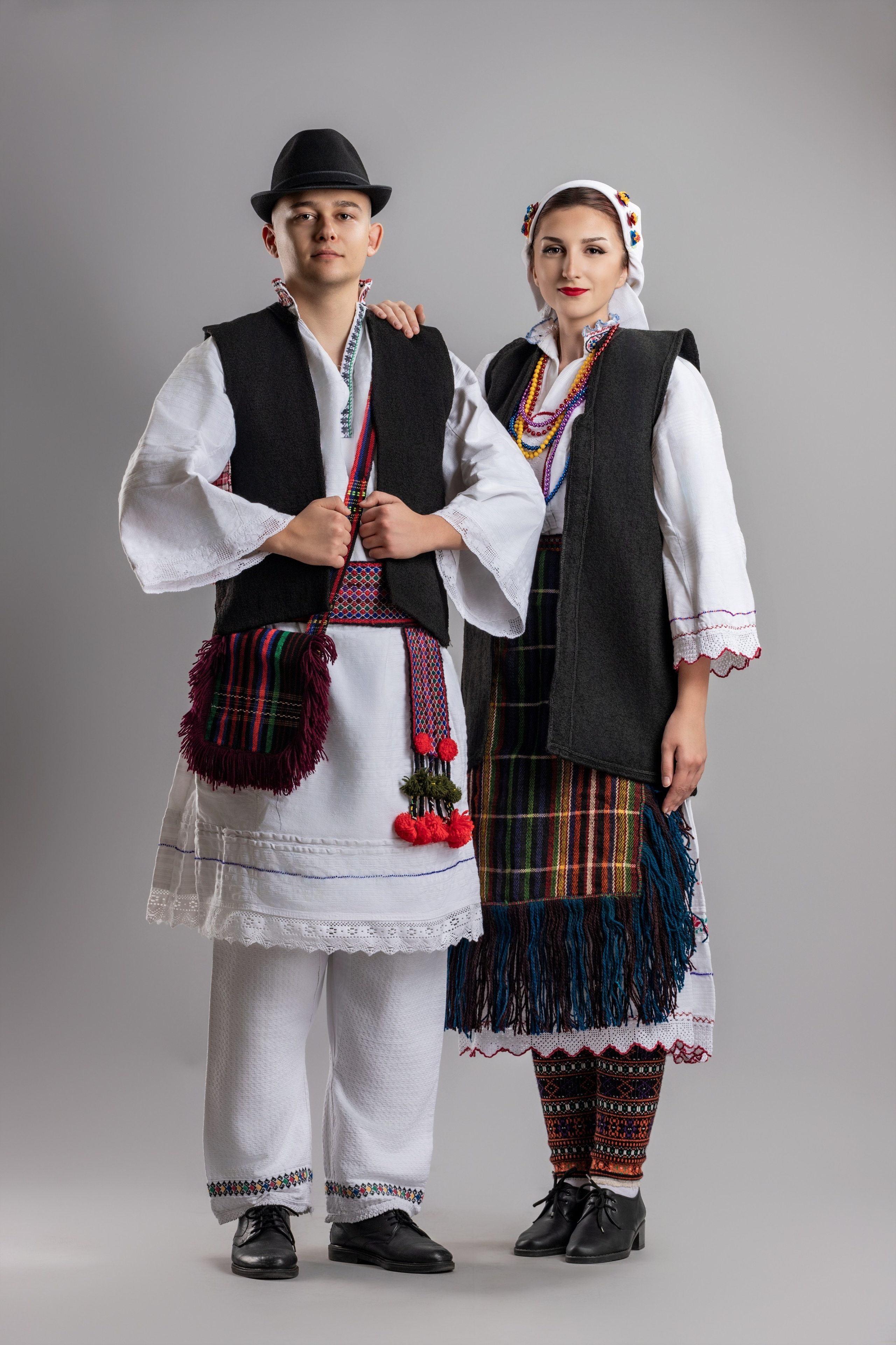 Studio portrait photography of traditional folk costumes from Bosnia and Herzegovina featuring authentic cultural clothing, embroidery, jewelry and handcrafted garments, photographed by Namir Čomaga. The images highlight the richness, craftsmanship and cultural heritage of Bosnian traditional costumes through carefully lit studio portraits.