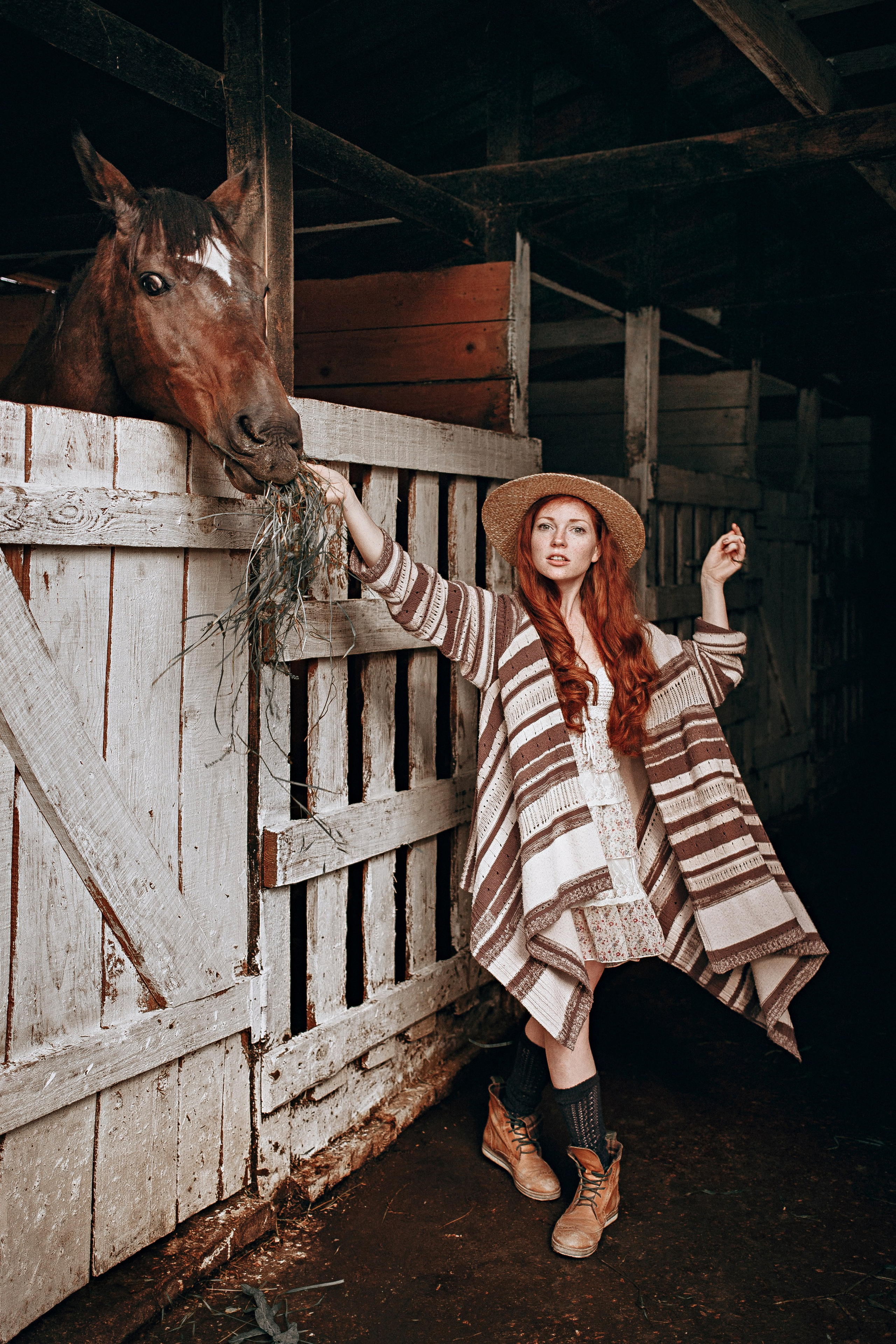 A serene portrait of a woman gently holding the reins of a majestic horse. The horse’s calm presence and the model’s peaceful smile create a harmonious scene, emphasizing the deep connection and mutual respect between humans and horses. The natural backdrop adds to the tranquil and timeless beauty of this moment.