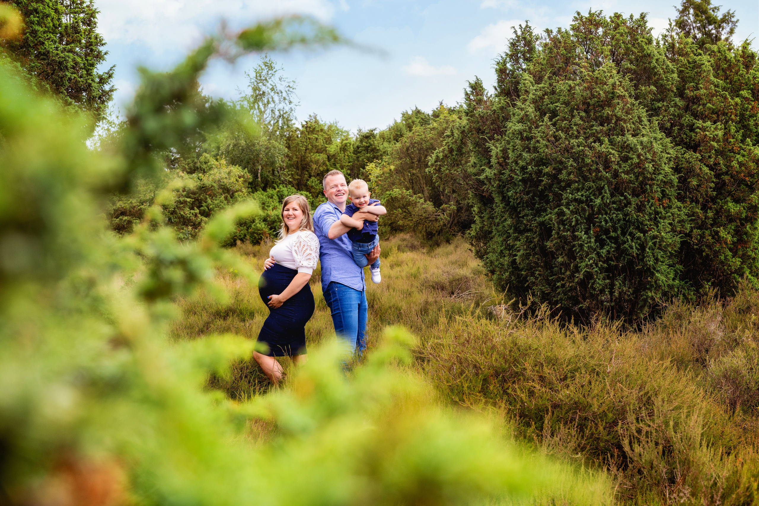 Fotosessie van de zwangerschap met gezin