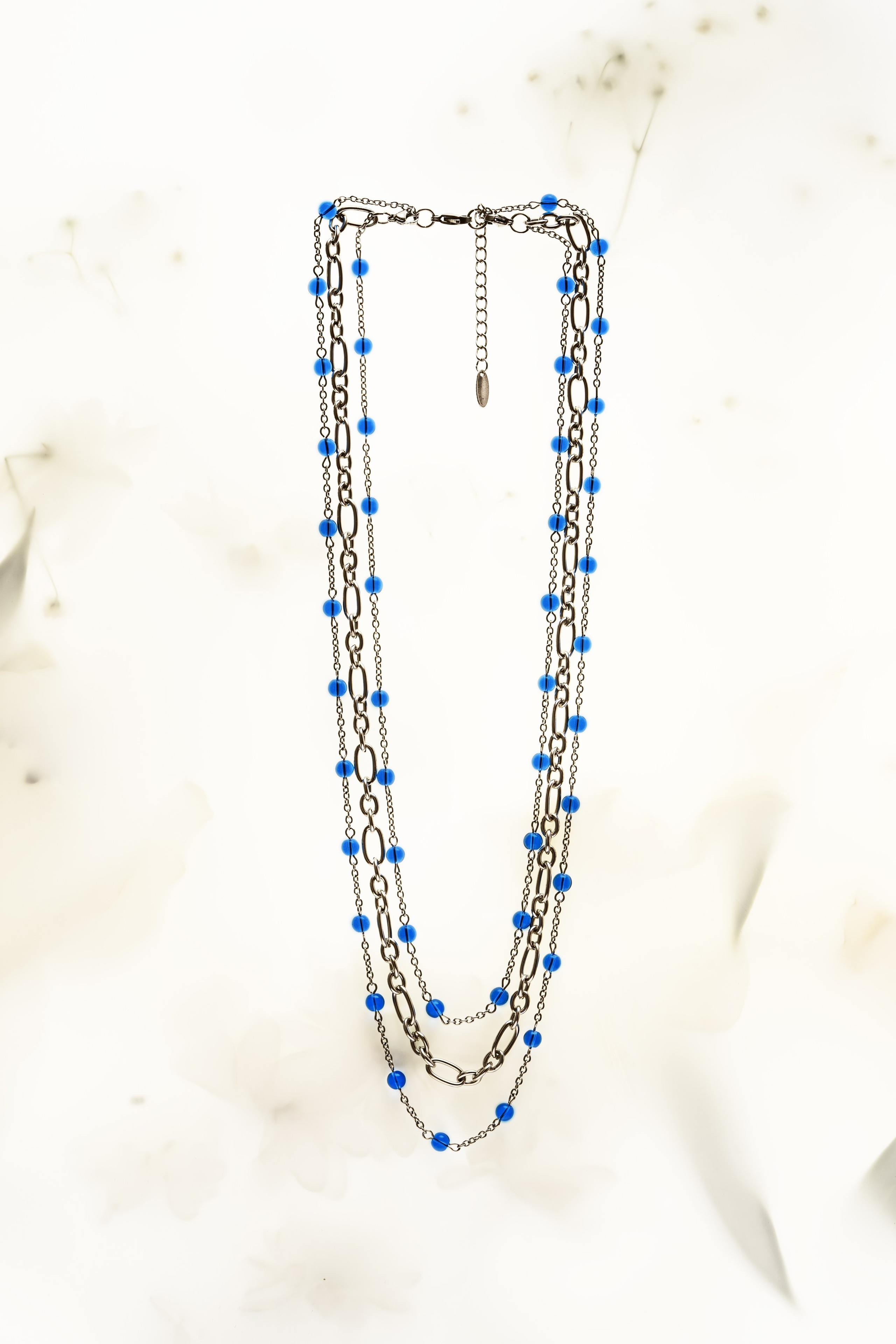 Macro photography of a gemstone ring emphasizing its detailed cuts and clarity.