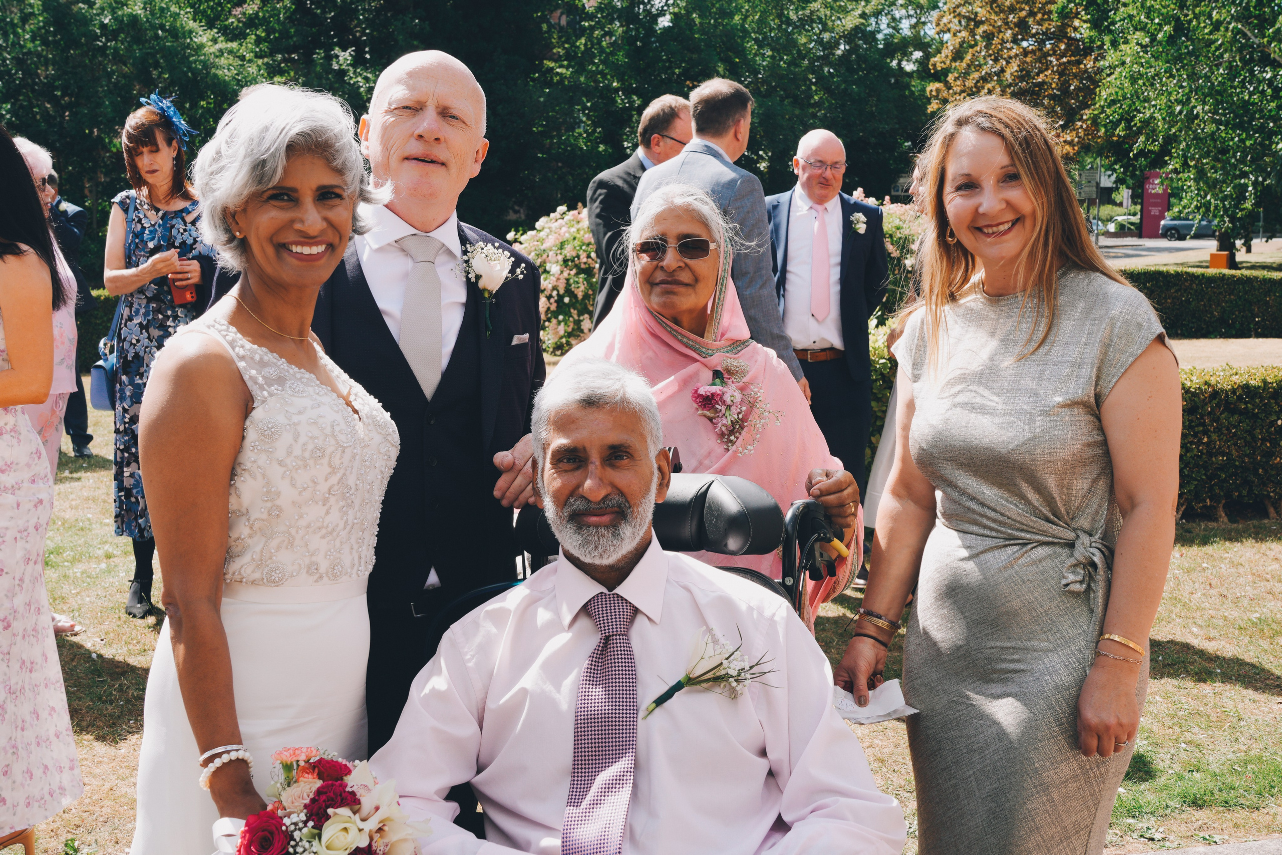 Relaxed family gathering outside Solihull Register Office on wedding day
