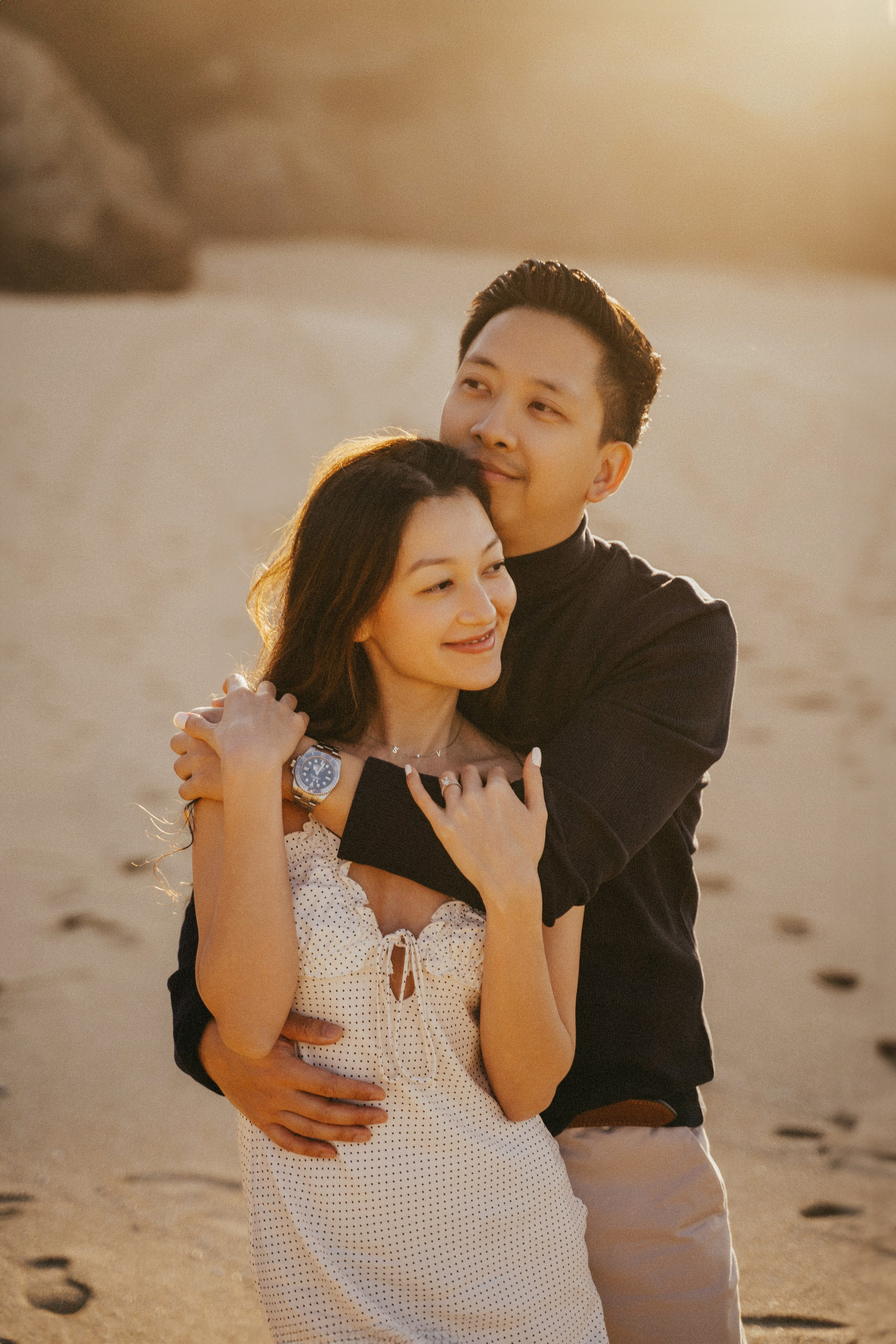 A photo shoot on the San Francisco beach at sunset. Engagement session. 