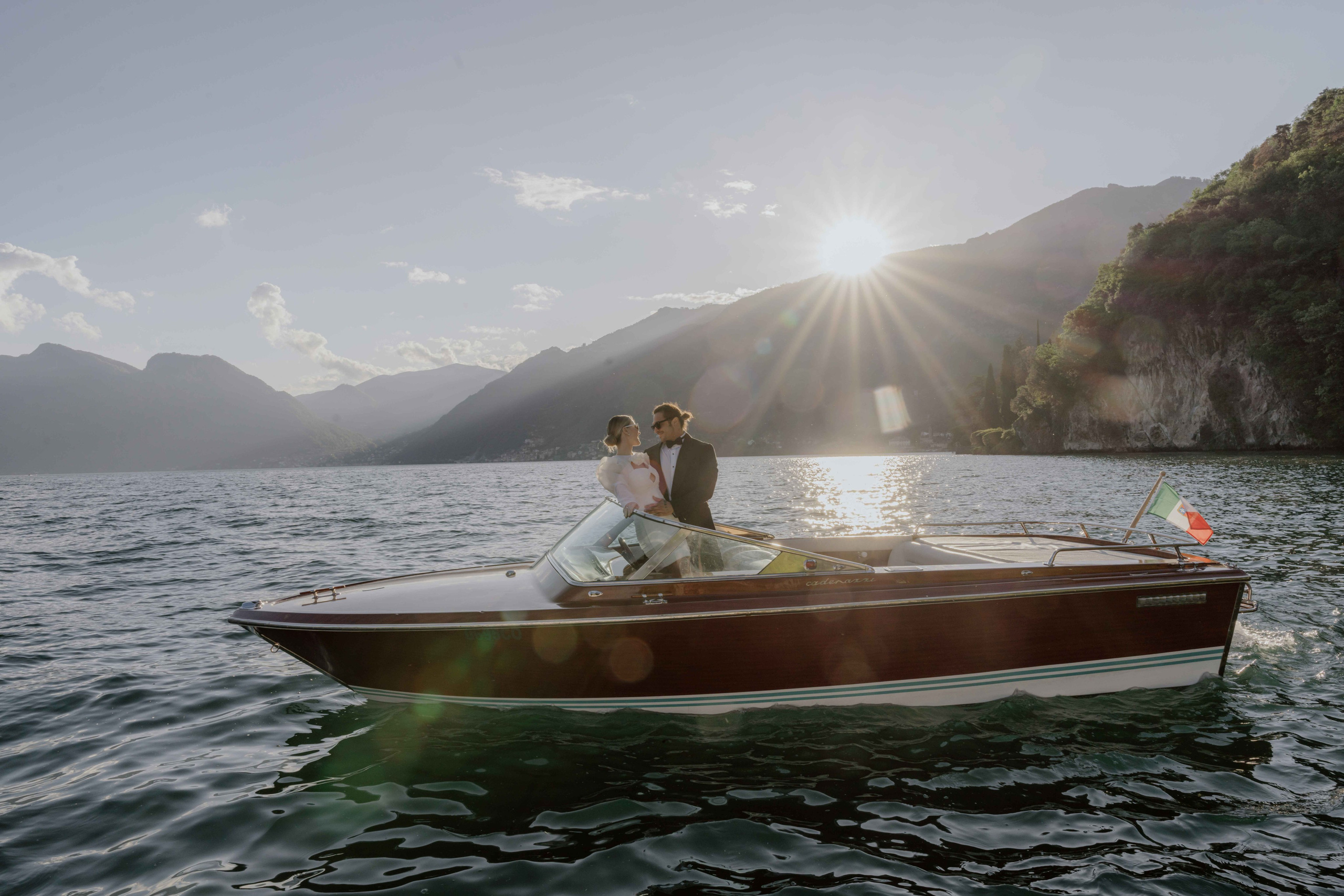  intimate Lake Como elopement couple on boat at sunset Italy