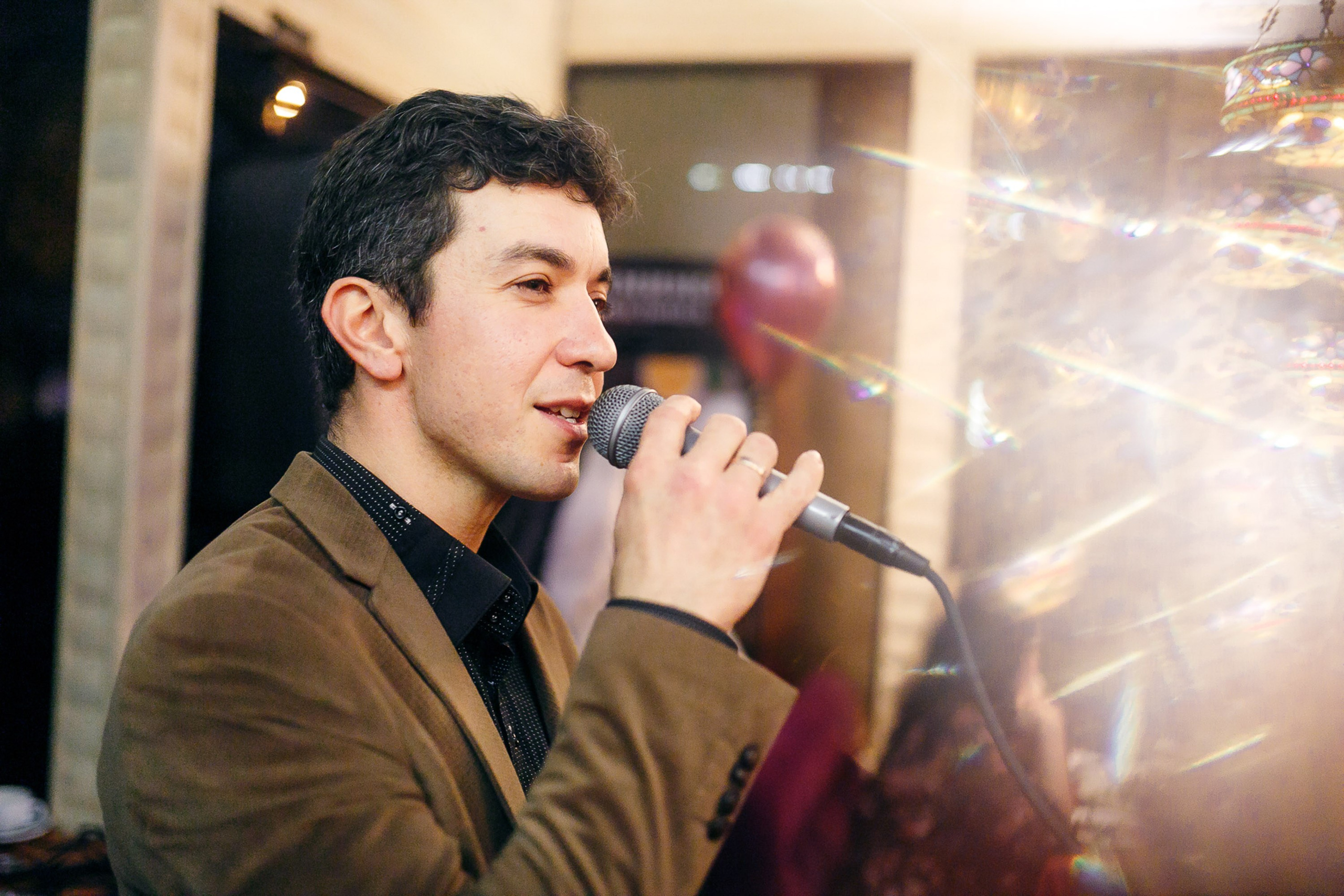 Man singing at the event, casual moment