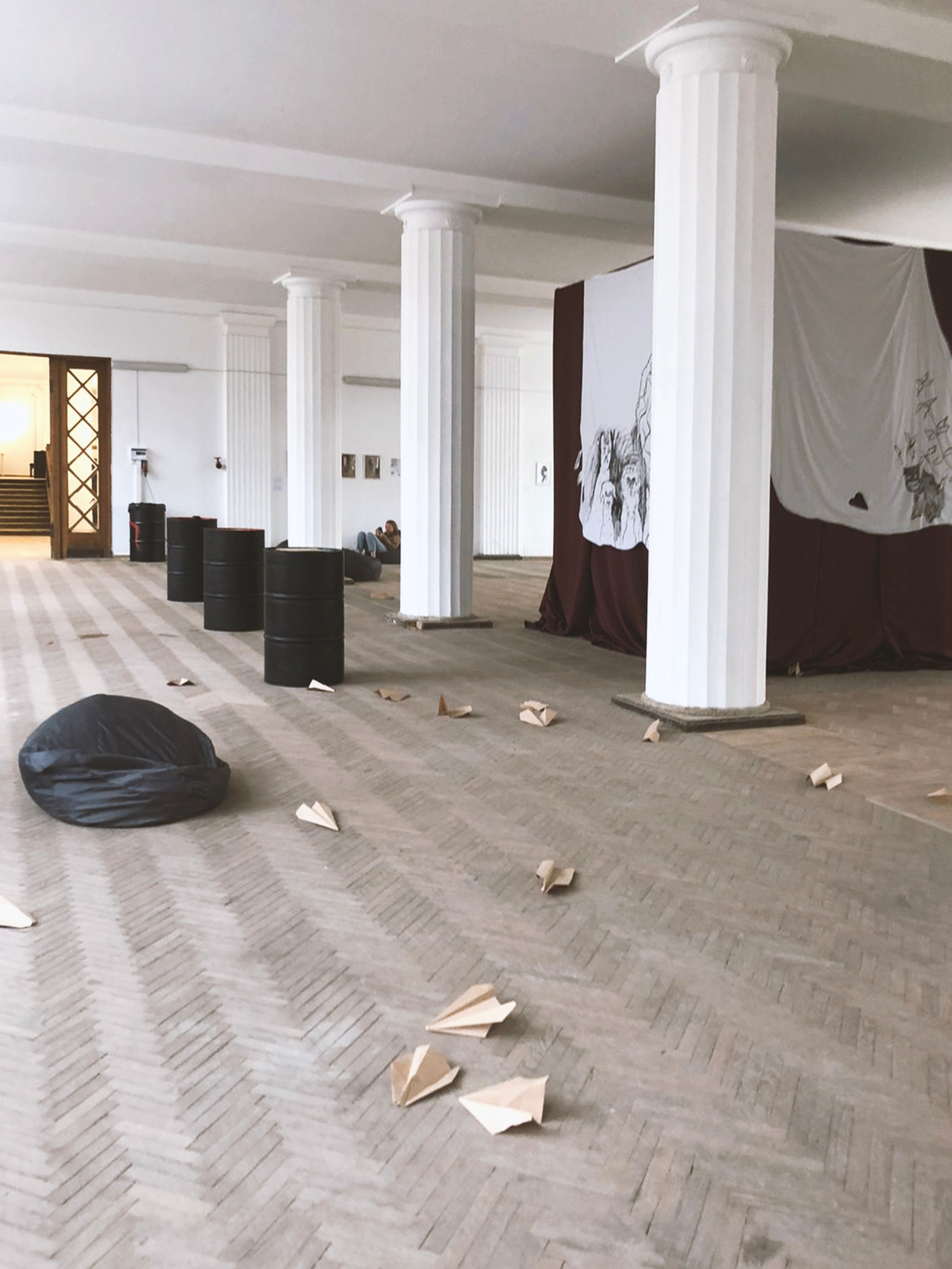 'Let go', 2022. Craft paper, pens, audio track, sofa bean bags https://on.soundcloud.com/6b5A7 In collaboration with composer Alexey Shlykov (Mr. Pepper) artist invites you to become participants in the ritual. Make yourself comfortable, and sit down on the bean bag to think about what to write down on paper: your desires, fears, and thoughts. Make an airplane out of this experience and “let go” right here in the hall.