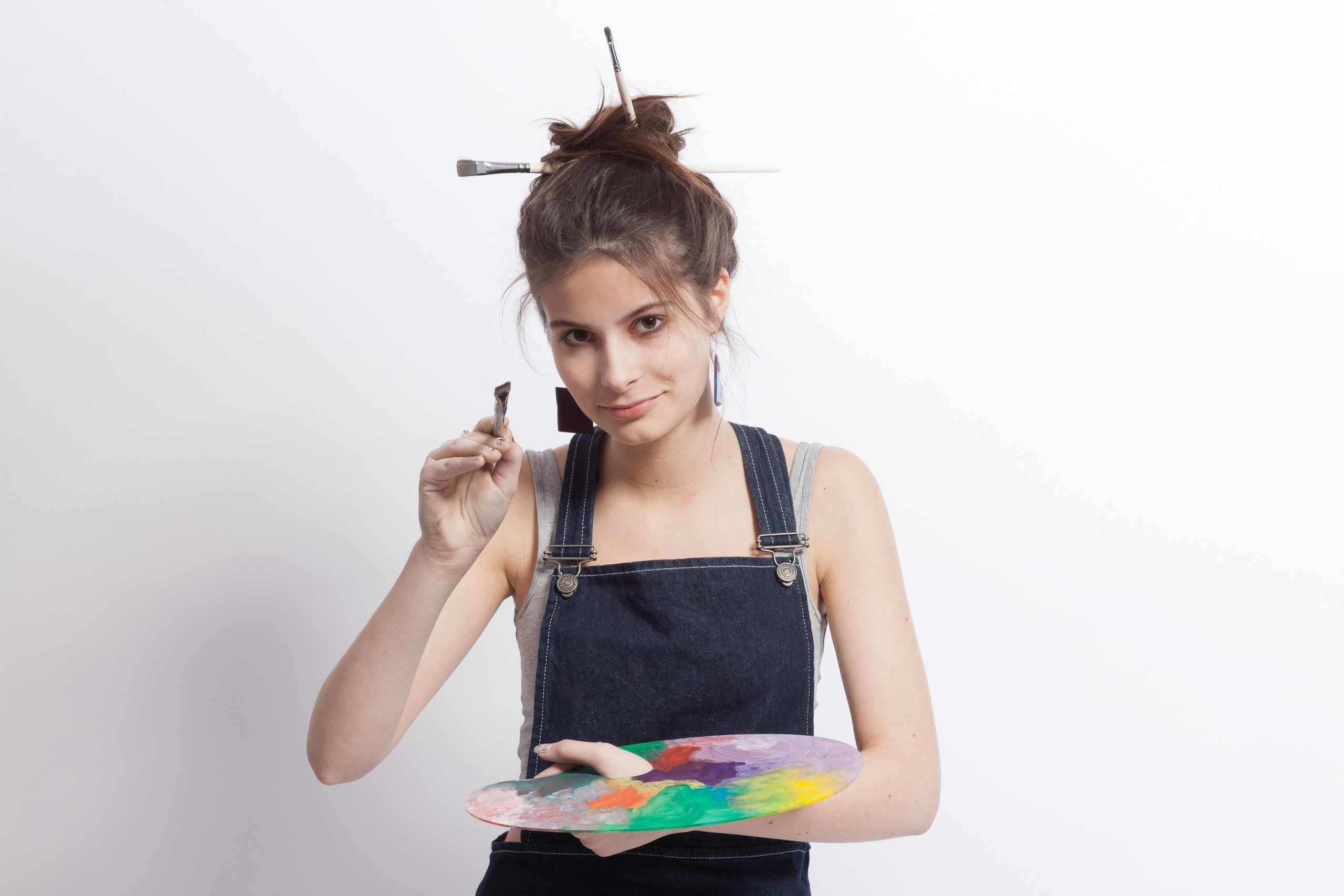 Portrait of a young artist girl on white studio background - photographer Andrey Dunin
