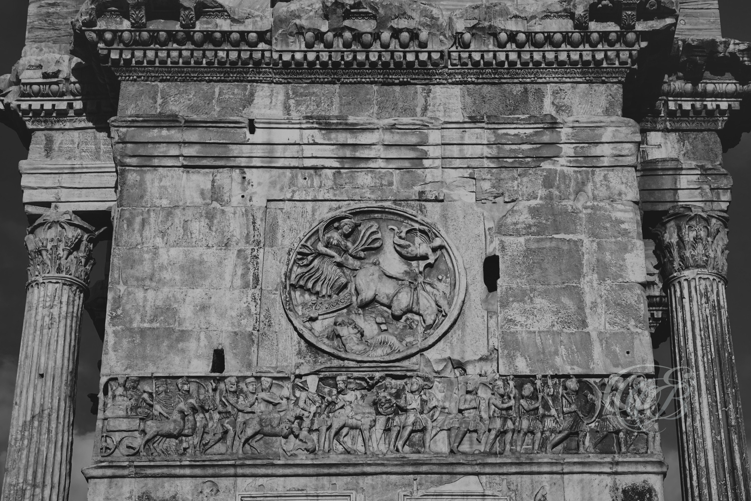 Rome Italy – Arch of Constantine near the Colosseum, triumphal Roman monument adorned with imperial reliefs and inscriptions, captured in black and white fine art photography. Rome, Italy – photography by Eduardo Bartoli.