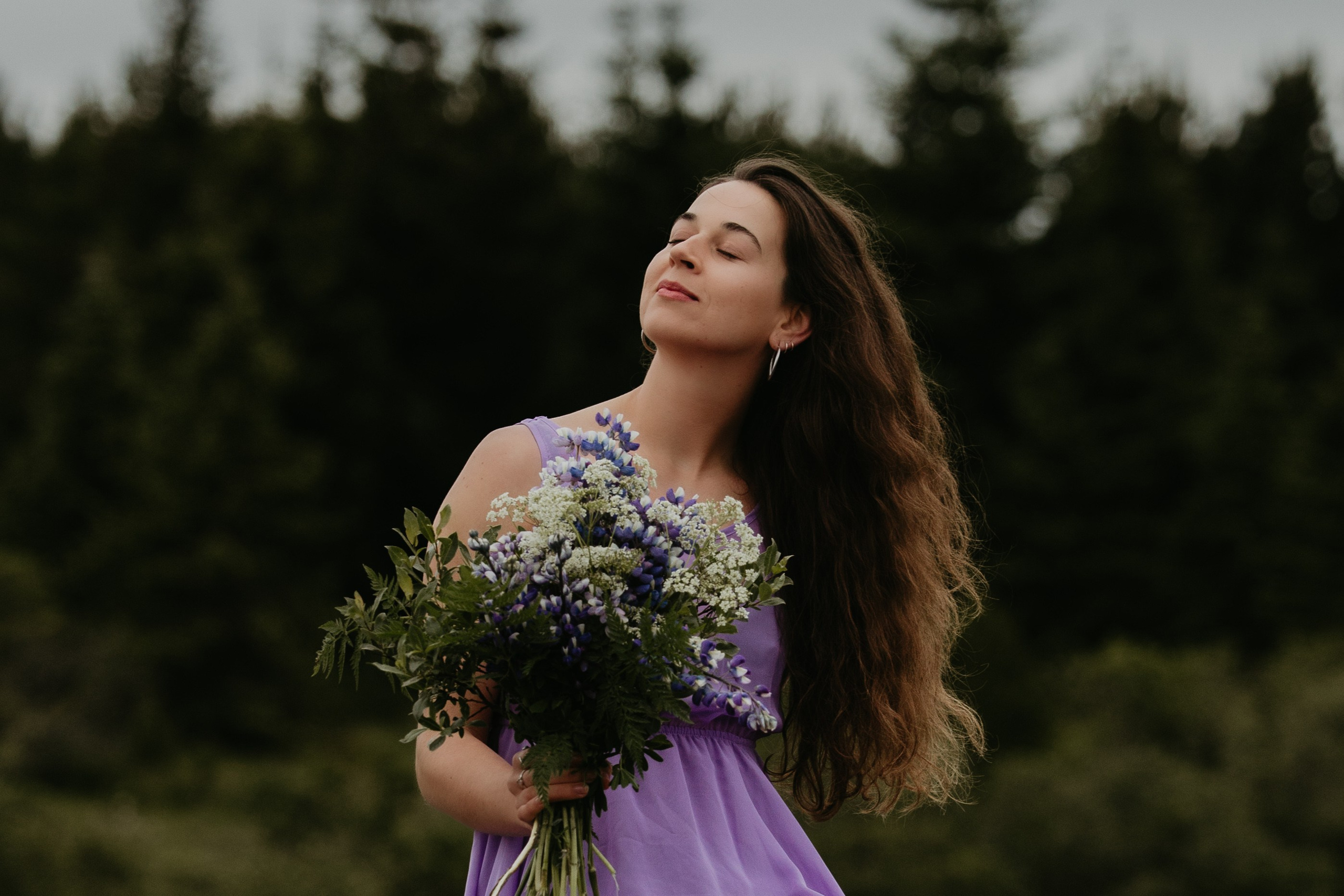 Wind in her hair—dreamy feminine portrait in Iceland’s dramatic natural scenery.