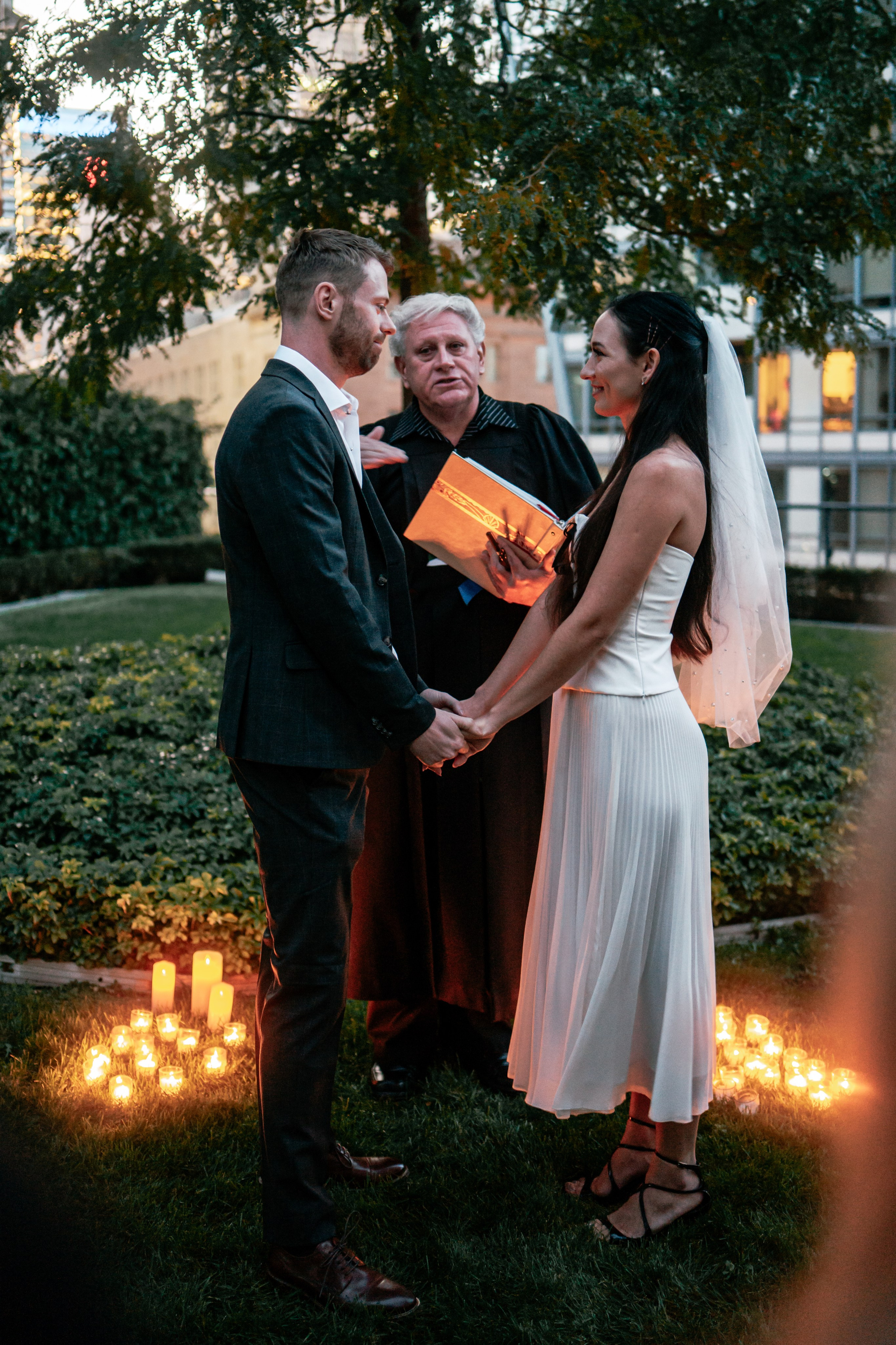 Candid wedding photography in Windsor, Ontario, showcasing the emotional first look during a wedding party.