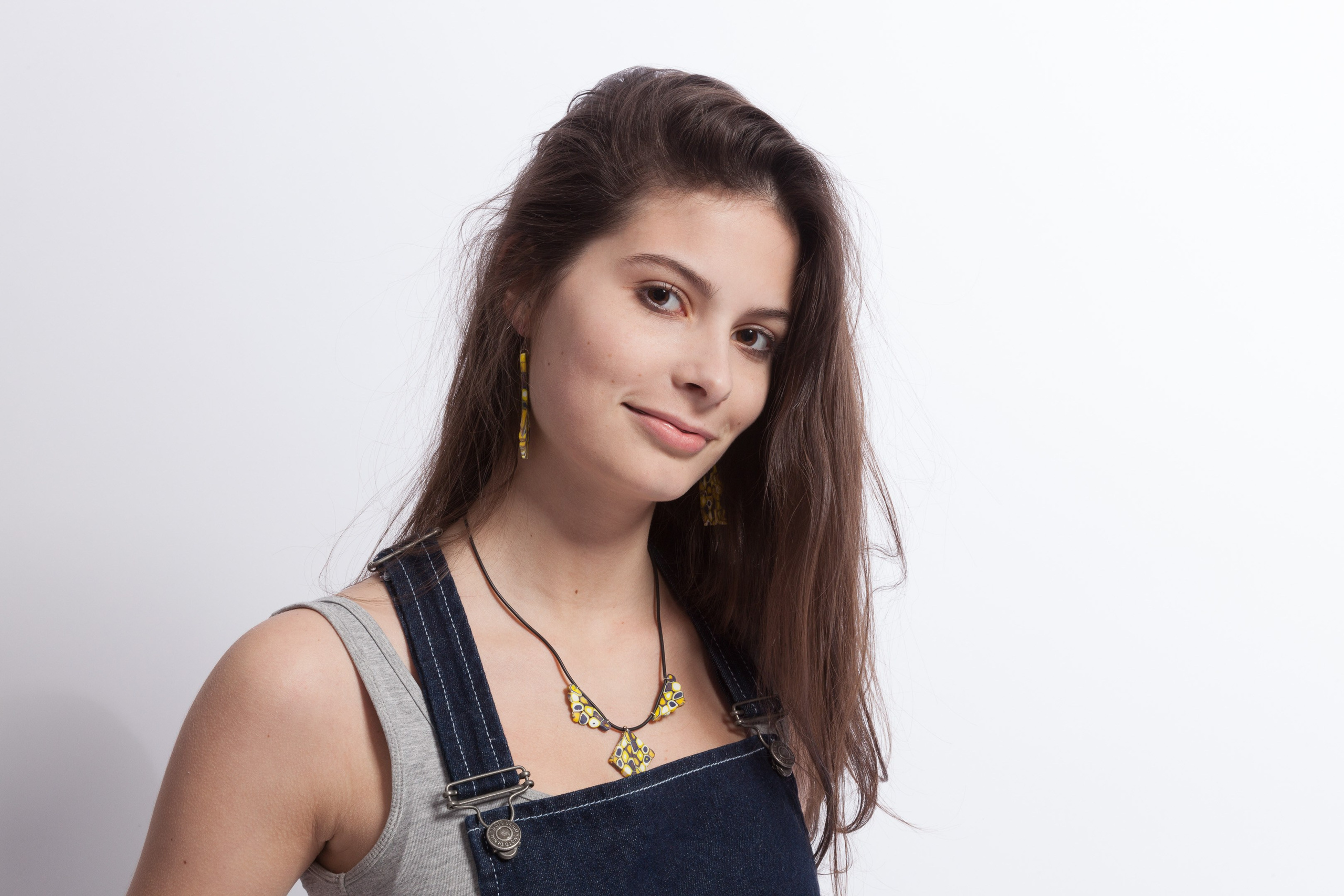 Portrait of a young girl on white studio background - photographer Andrey Dunin