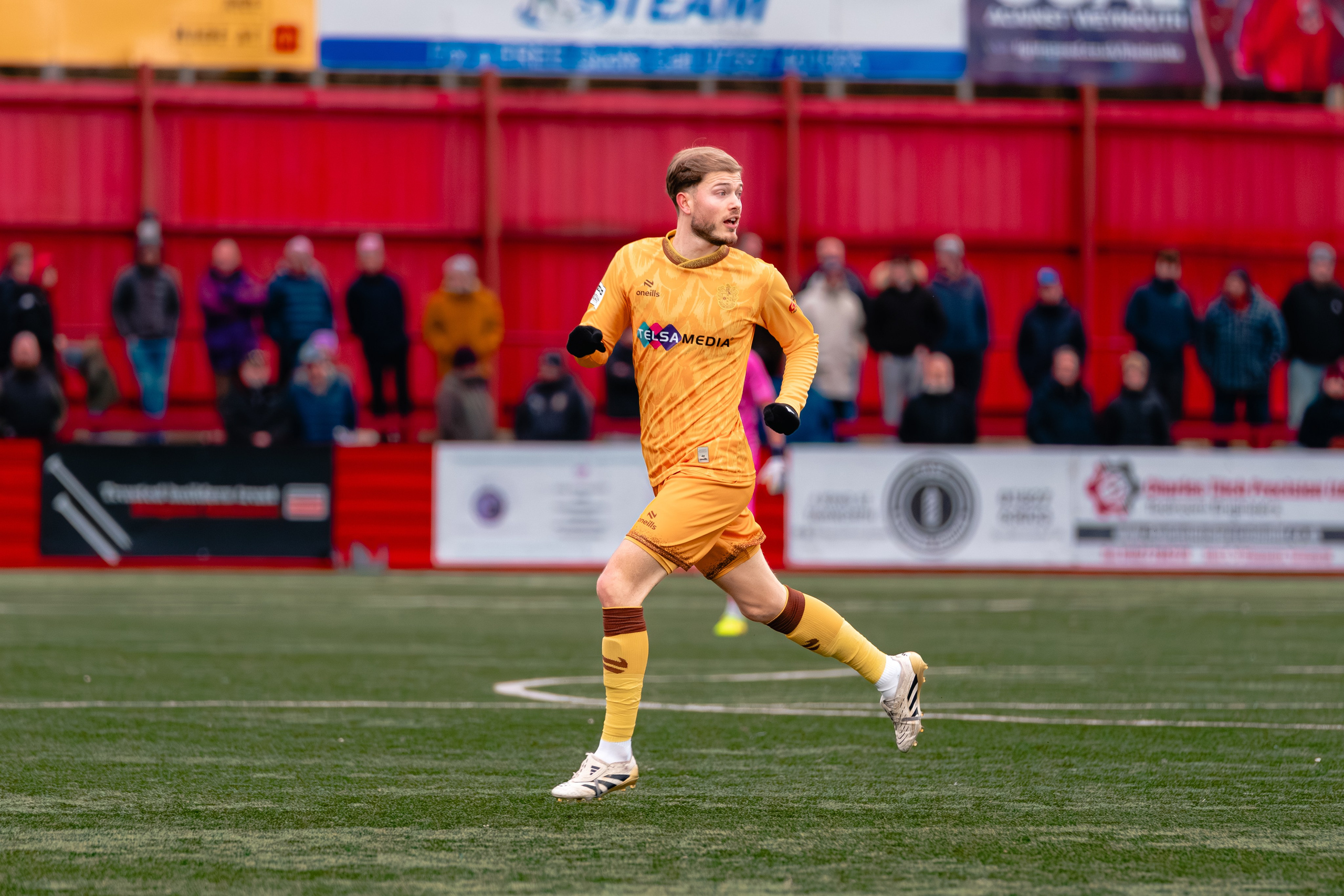Sutton United’s Lewis Simper runs upfield during open play