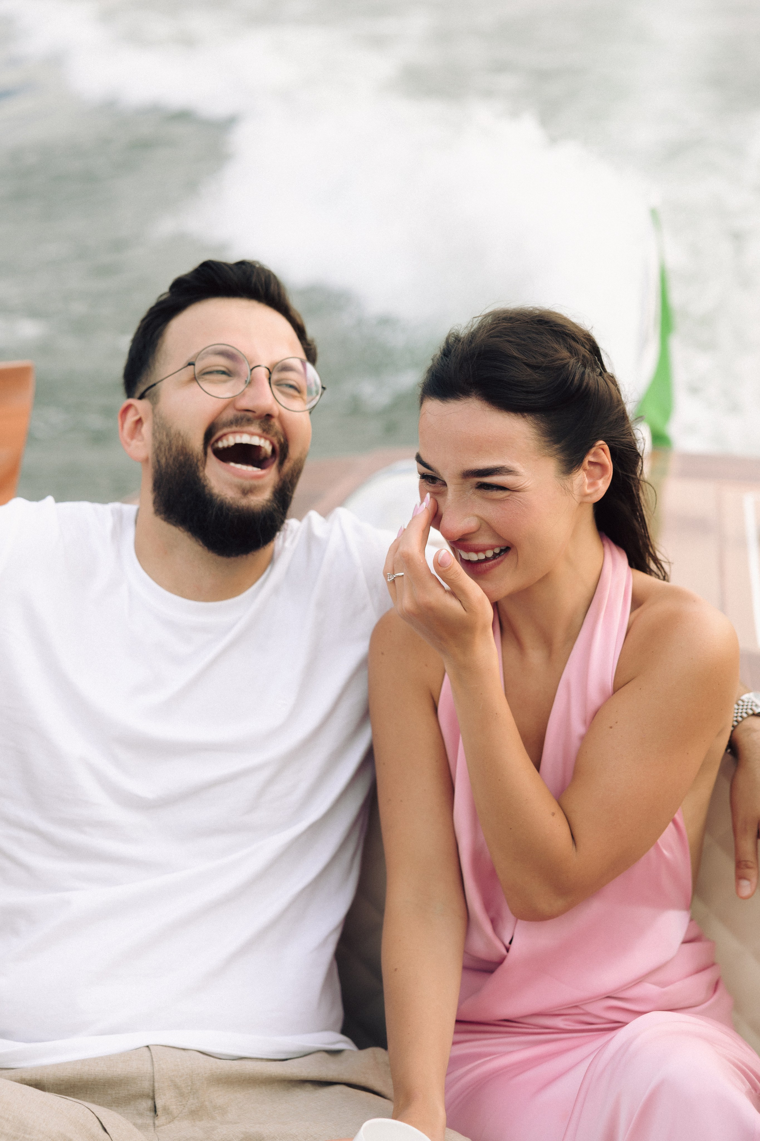 Emothional moment between newly engaged couple overlooking Lake Como