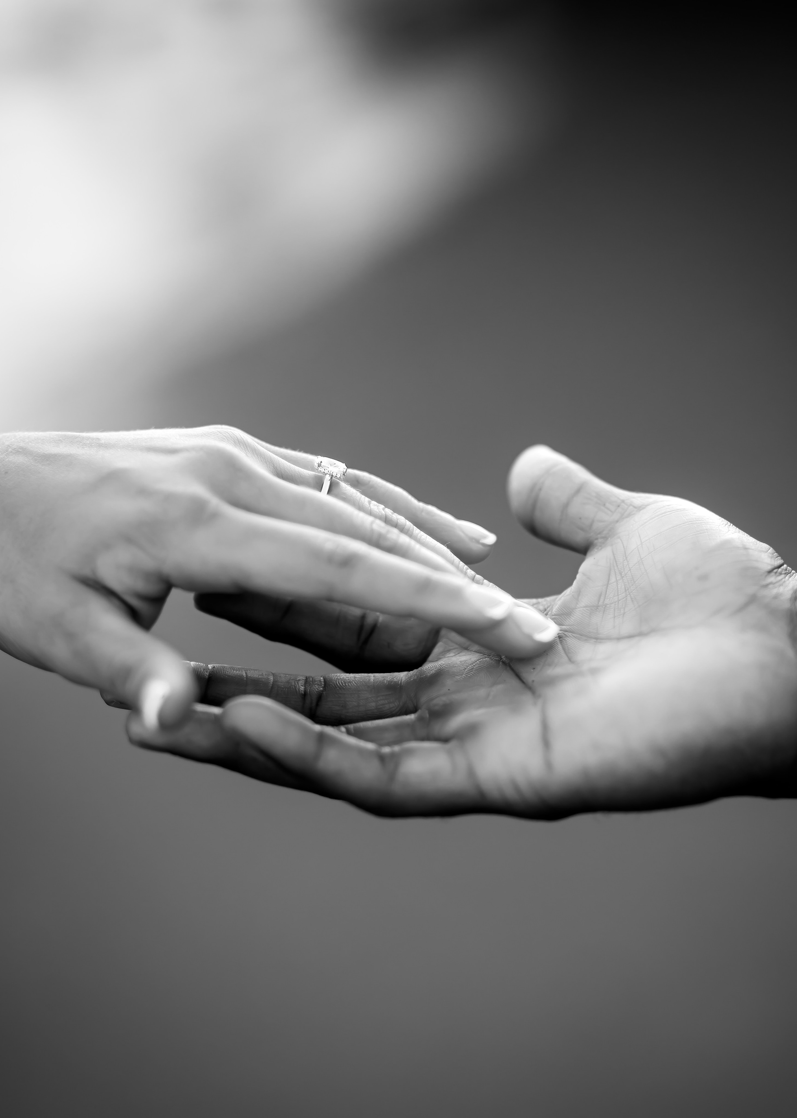 Close-up of an engagement ring placed on the bride’s finger during a romantic destination proposal in Málaga. Elegant detail photography capturing the emotion and symbolism of a Mediterranean engagement session.