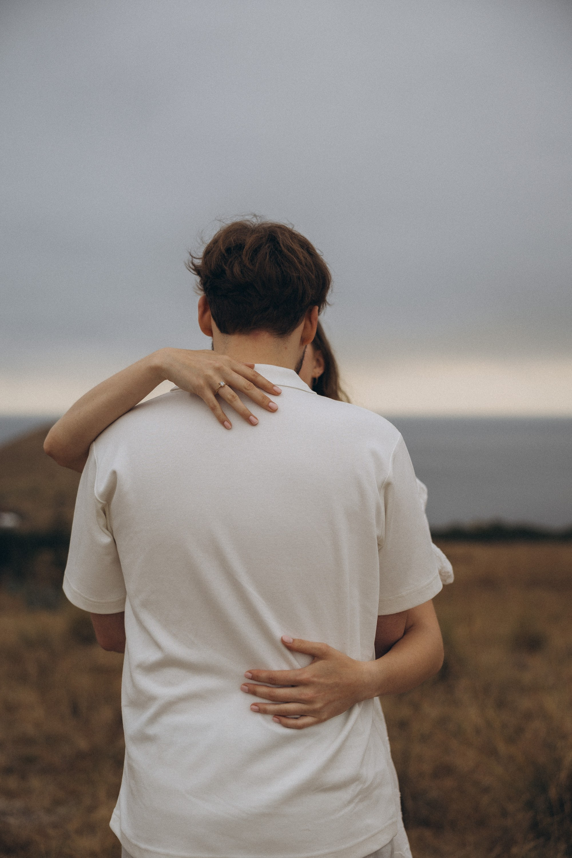Surprise marriage proposal in São Lourenço, Madeira – romantic couple photography on dramatic coastal cliffs