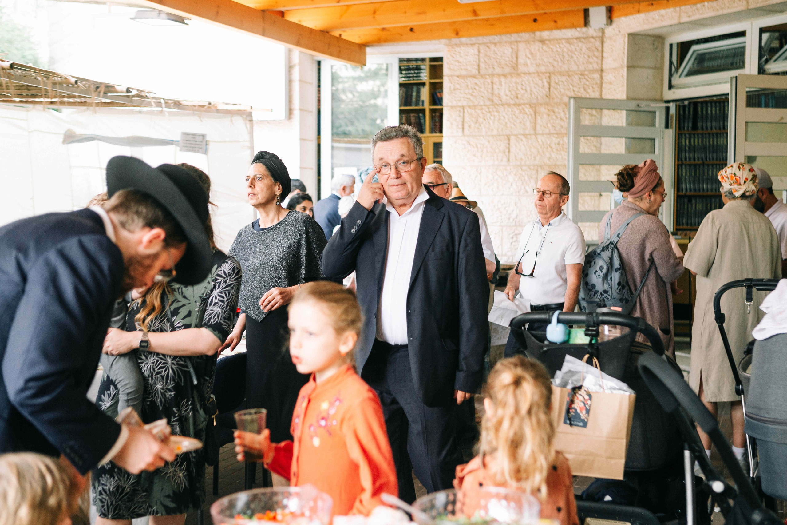 BRITH MILA IN THE SMALL SYNAGOGUE. PHOTOGRAPHER IN ISRAEL